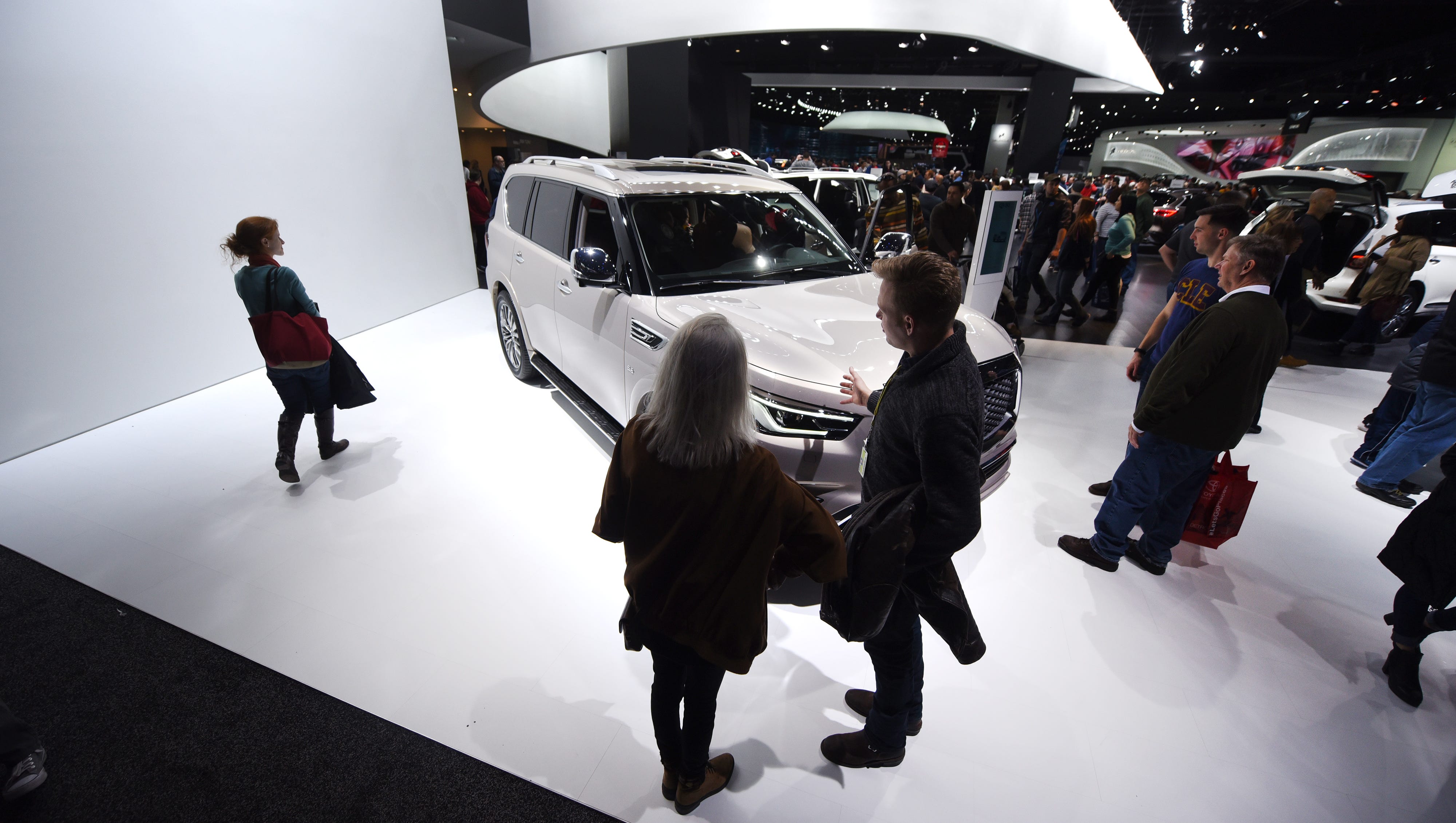 People surround the Infinity 2018 QX80 on Saturday January 20, 2018 for the first public day for the North American International Auto Show
