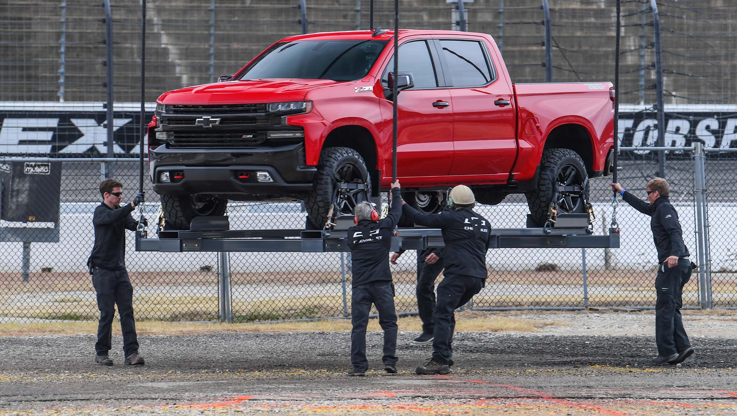 Seen for the first time, the all-new, 2019 Chevy Silverado was lowered by chopper onto the grounds of Chevy Motor Speedway in Dallas, Texas where it was removed from its harness - and paraded before Chevy customers.