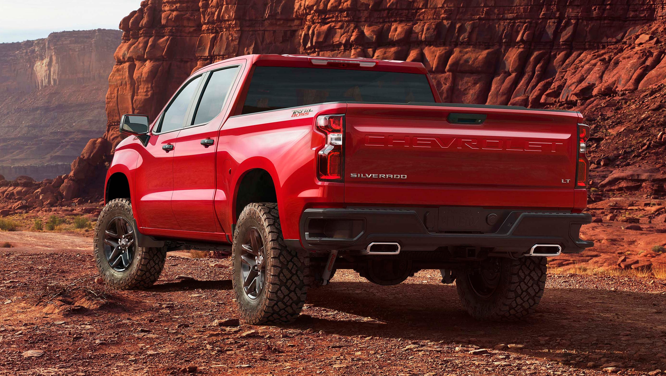 The rear of the all-new Chevy Silverado maintains the brands' signature vertical taillights and corner bumper step. New for '19 - "Chevrolet" gets stamped across the tailgate.