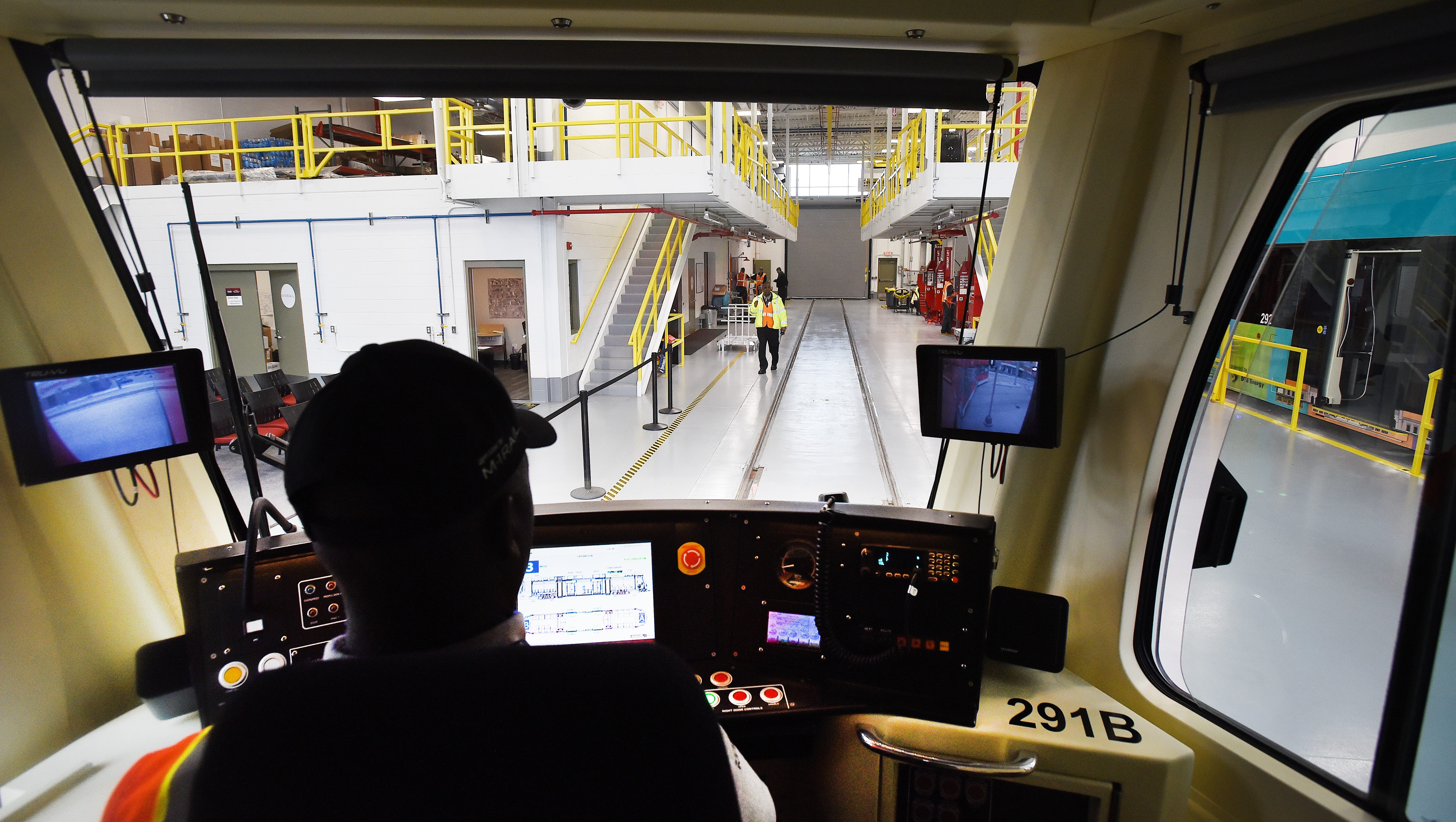 QLine operator Marcus Stewart pulls the street car into the Penske Tech Center off Woodward in the New Center area.