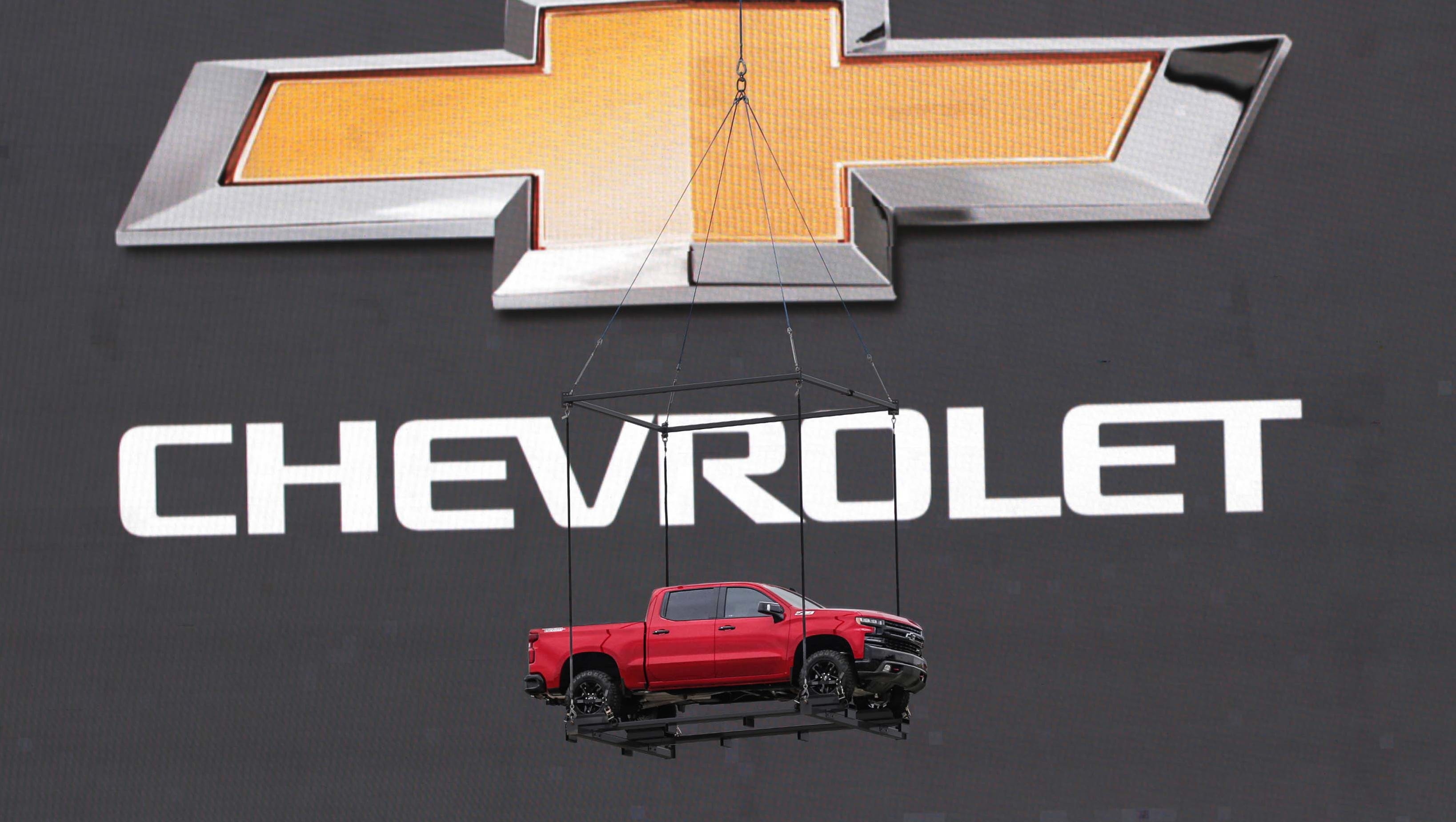 Carried into Texas Motor Speedway by shopper on a harness, the 2019 Cehvy Silverado was dramatically lowered in front of Chevy's logo to the ground.