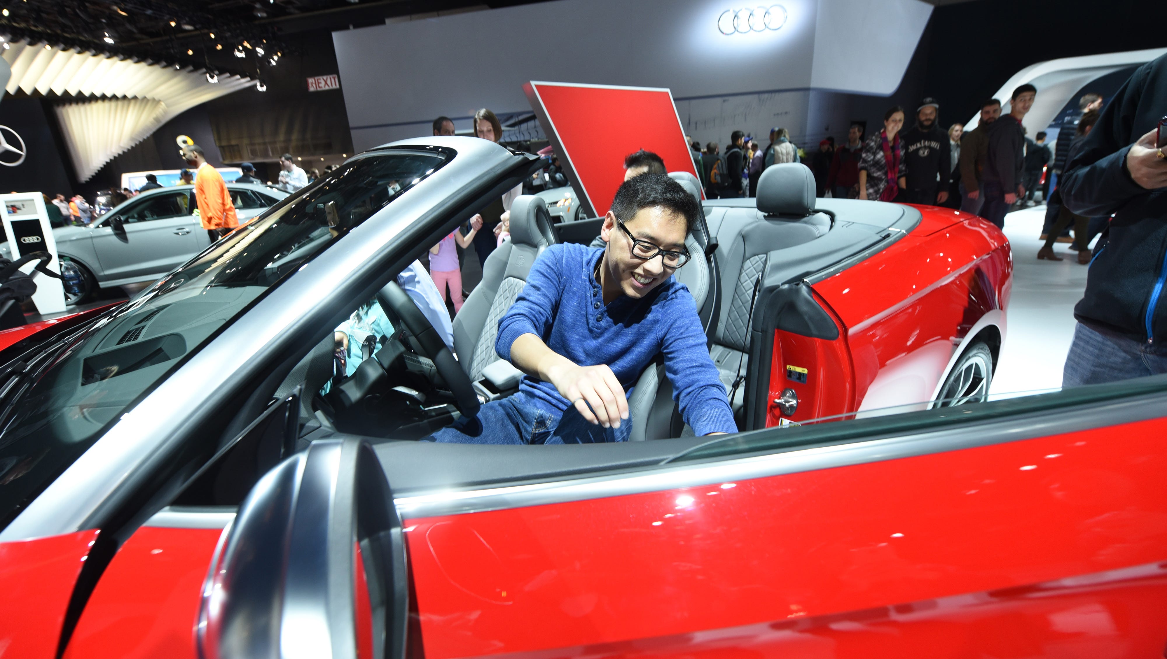 Sean Cui, of Novi, enjoys the 2018 Audi S5 Cabriolet on Saturday January 20, 2018 for the first public day for the North American International Auto Show