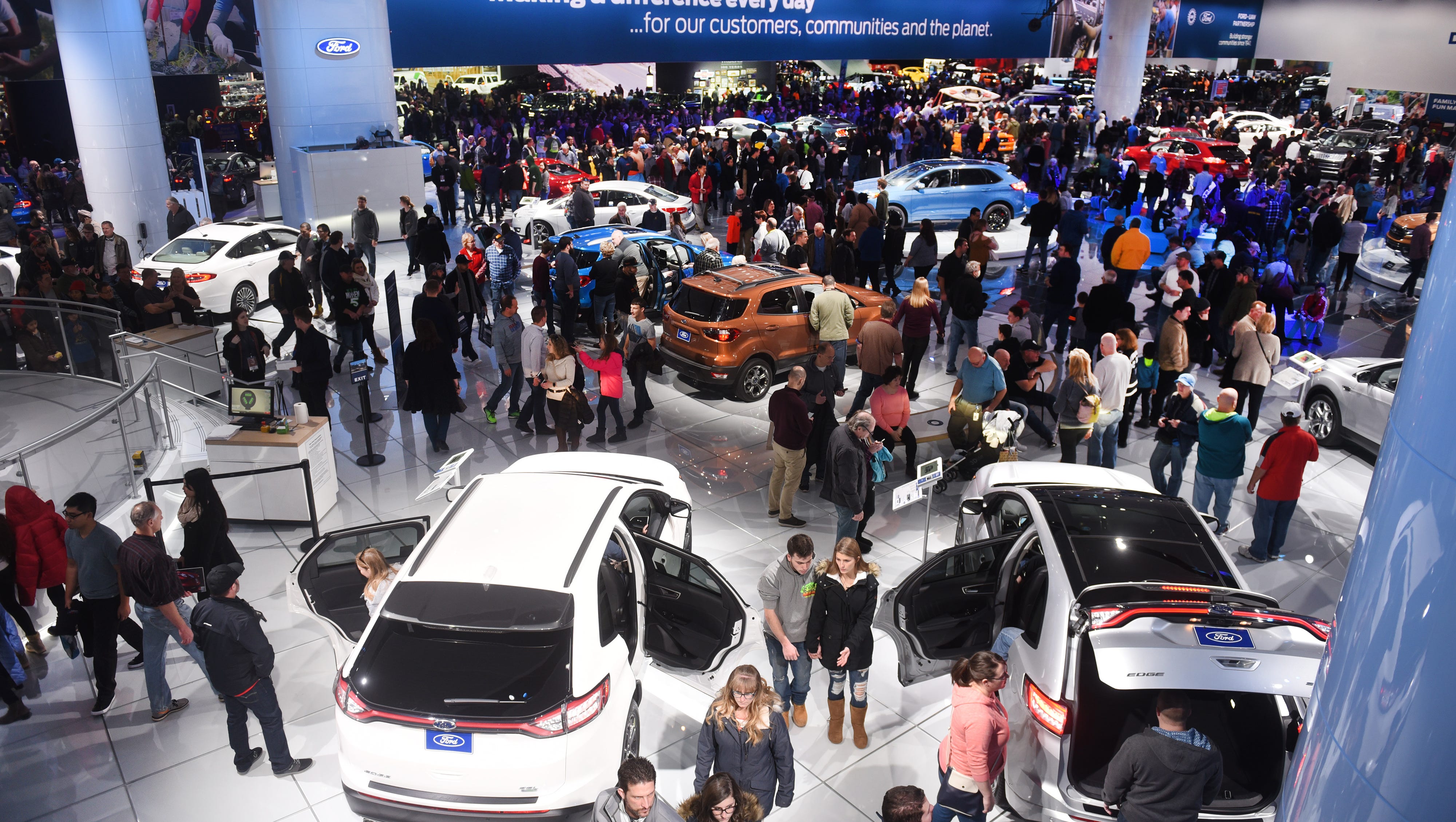 People look at the many Ford Motor Company vehicles on display at Cobo Center on Saturday January 20, 2018 for the North American International Auto Show