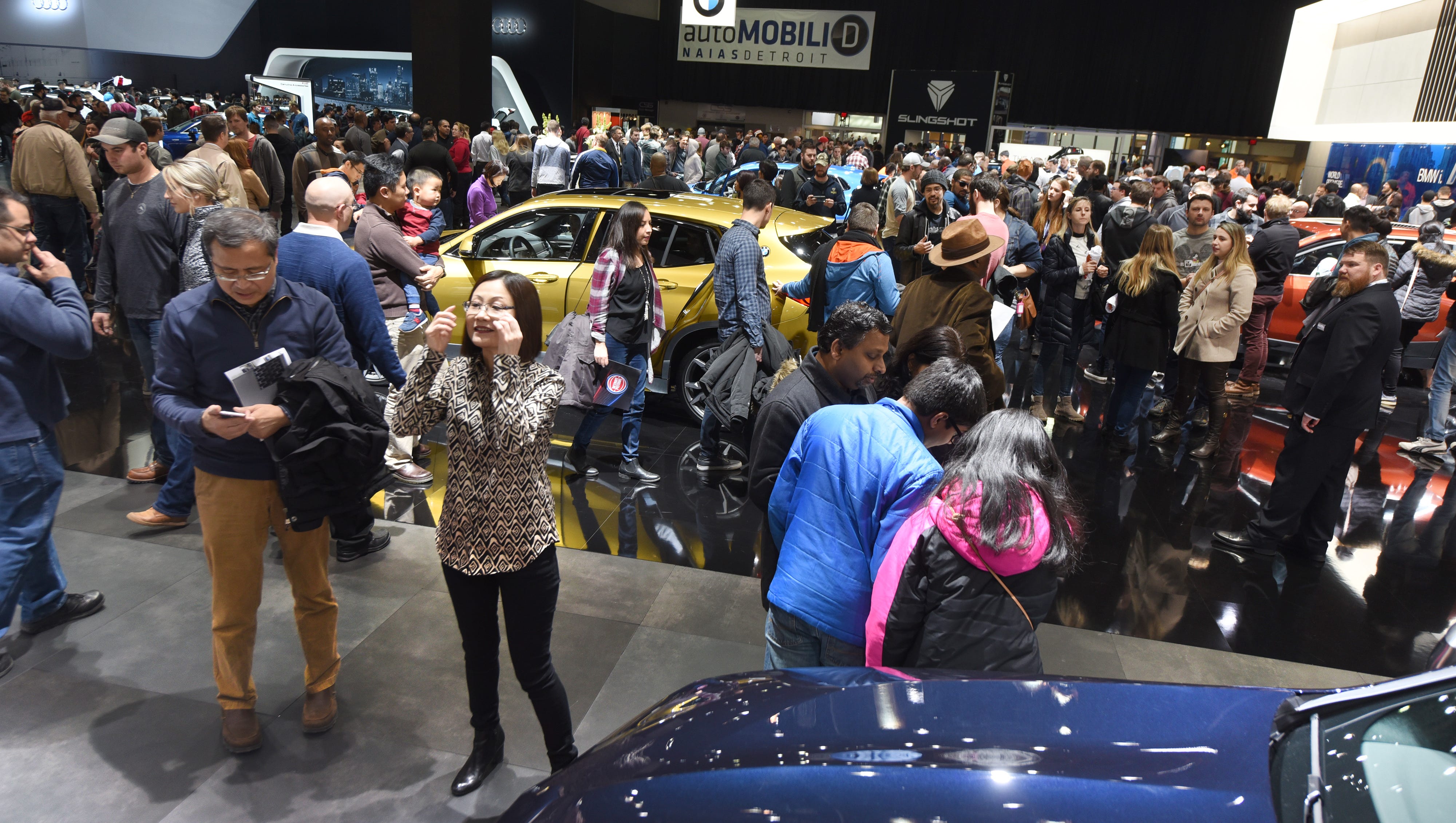Thousands of people fill Cobo Center on Saturday January 20, 2018 at the BMW display for the first public day for the North American International Auto Show