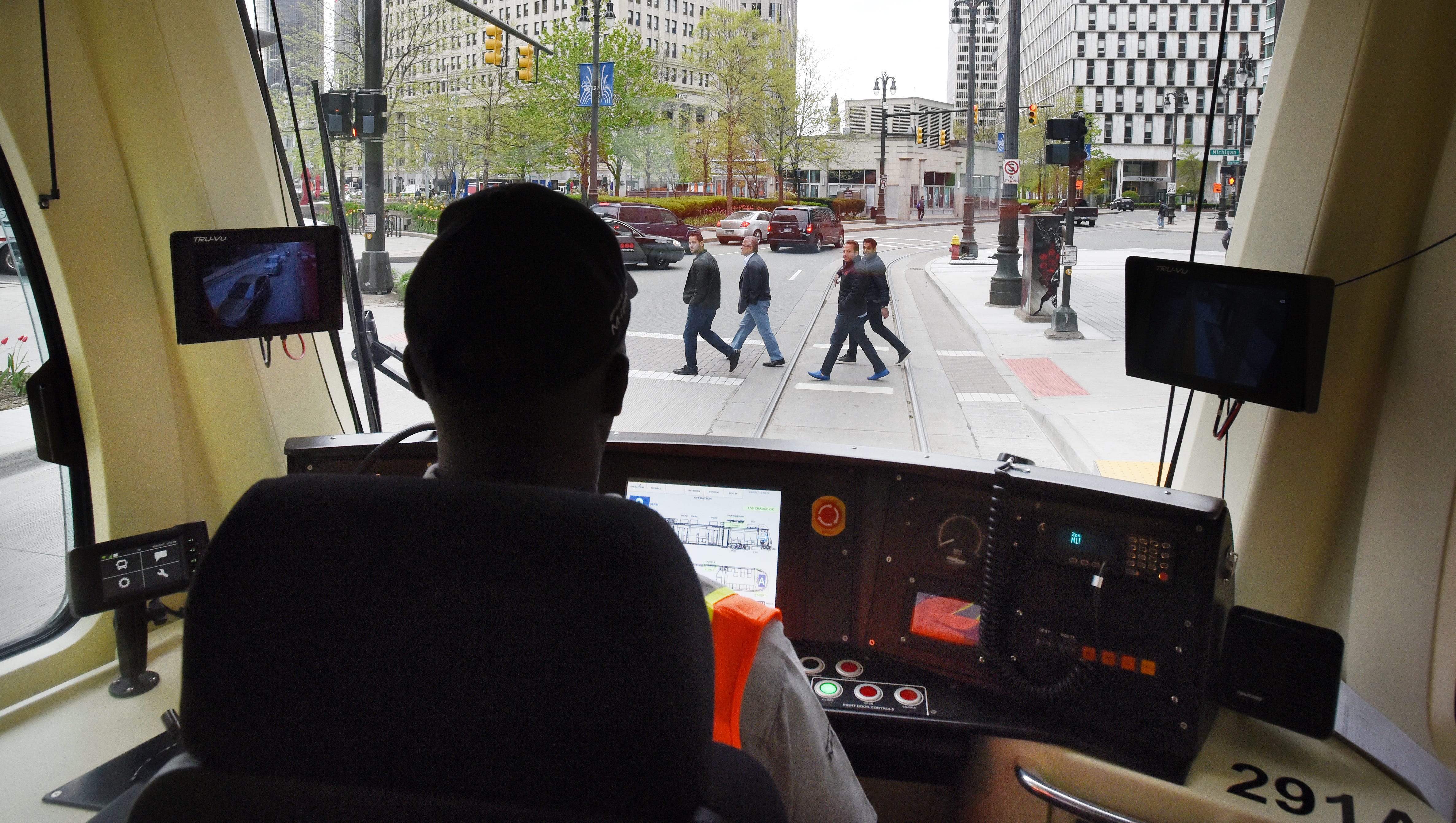 QLine streetcar operator Marcus Stewart waits at the light as he makes his way south down Woodward in the Campus Martius area.