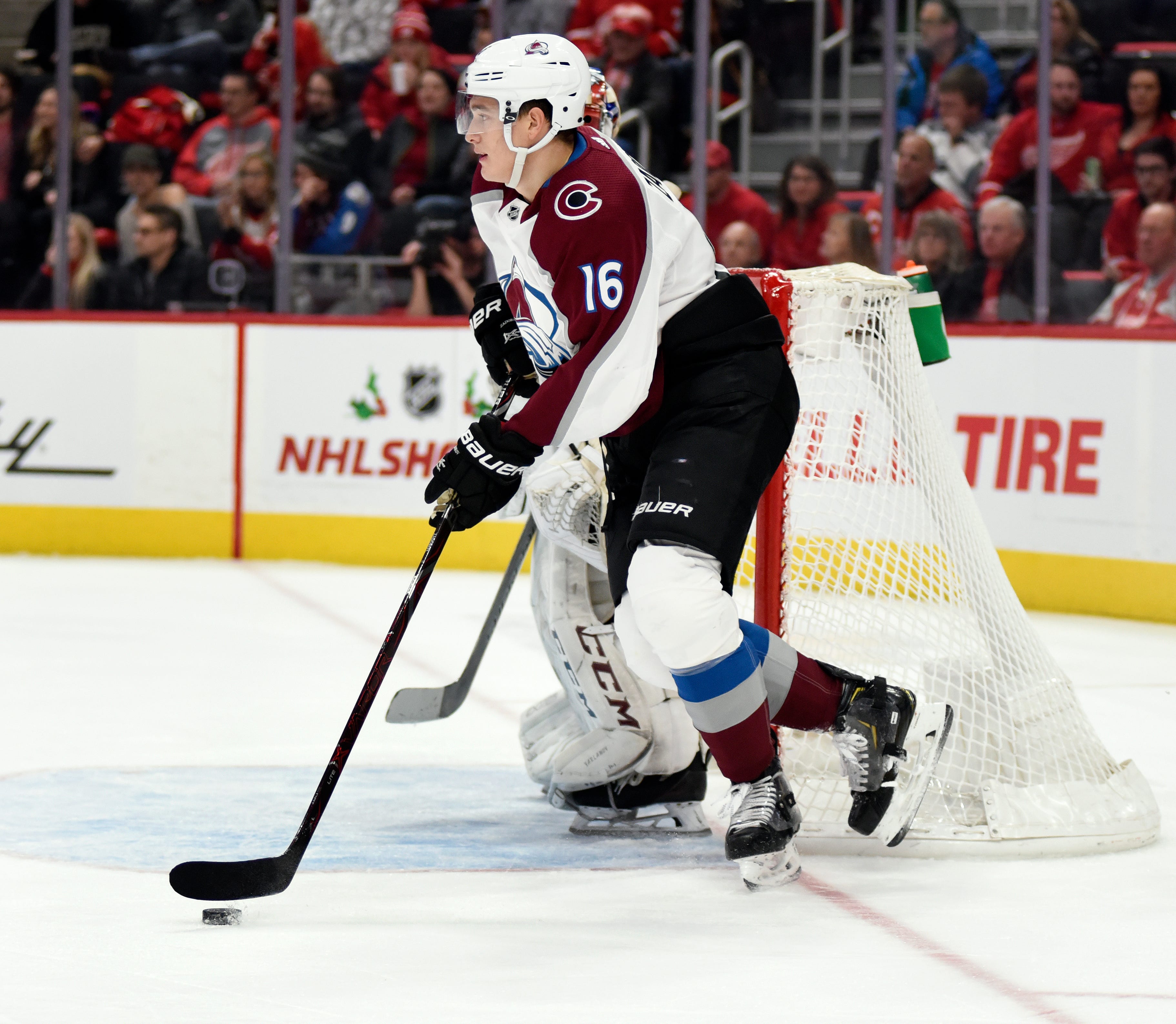 Avalanche defenseman Nikita Zadorov moves the puck up ice against the Red Wings during the second period.