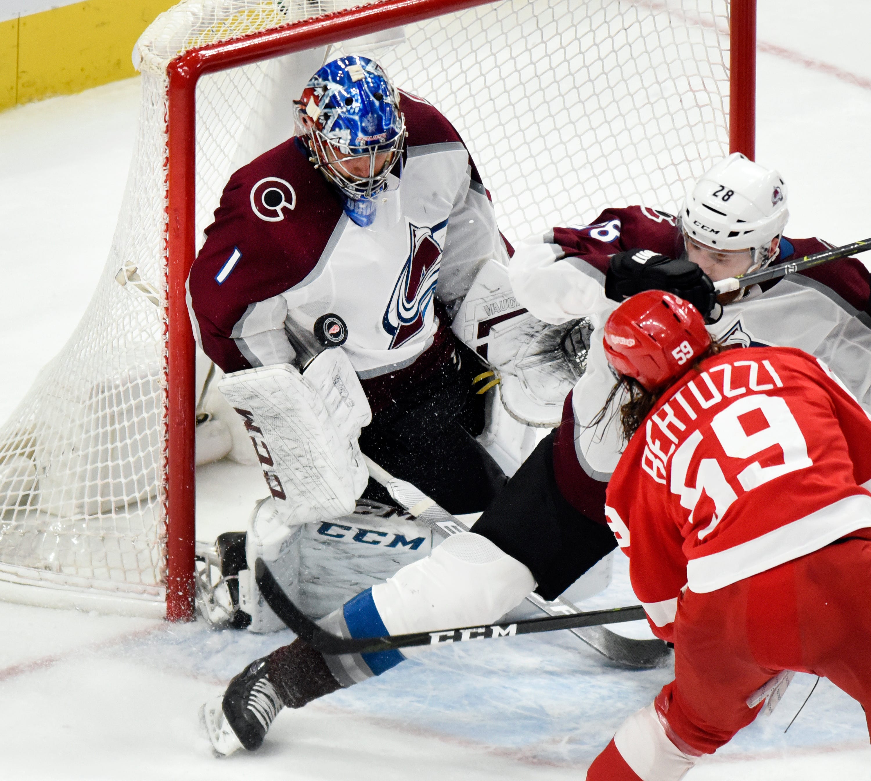 Avalanche goaltender Semyon Varlamov blocks the shot of Red Wings left wing Tyler Bertuzzi as defenseman Ian Cole slides in during the third period.