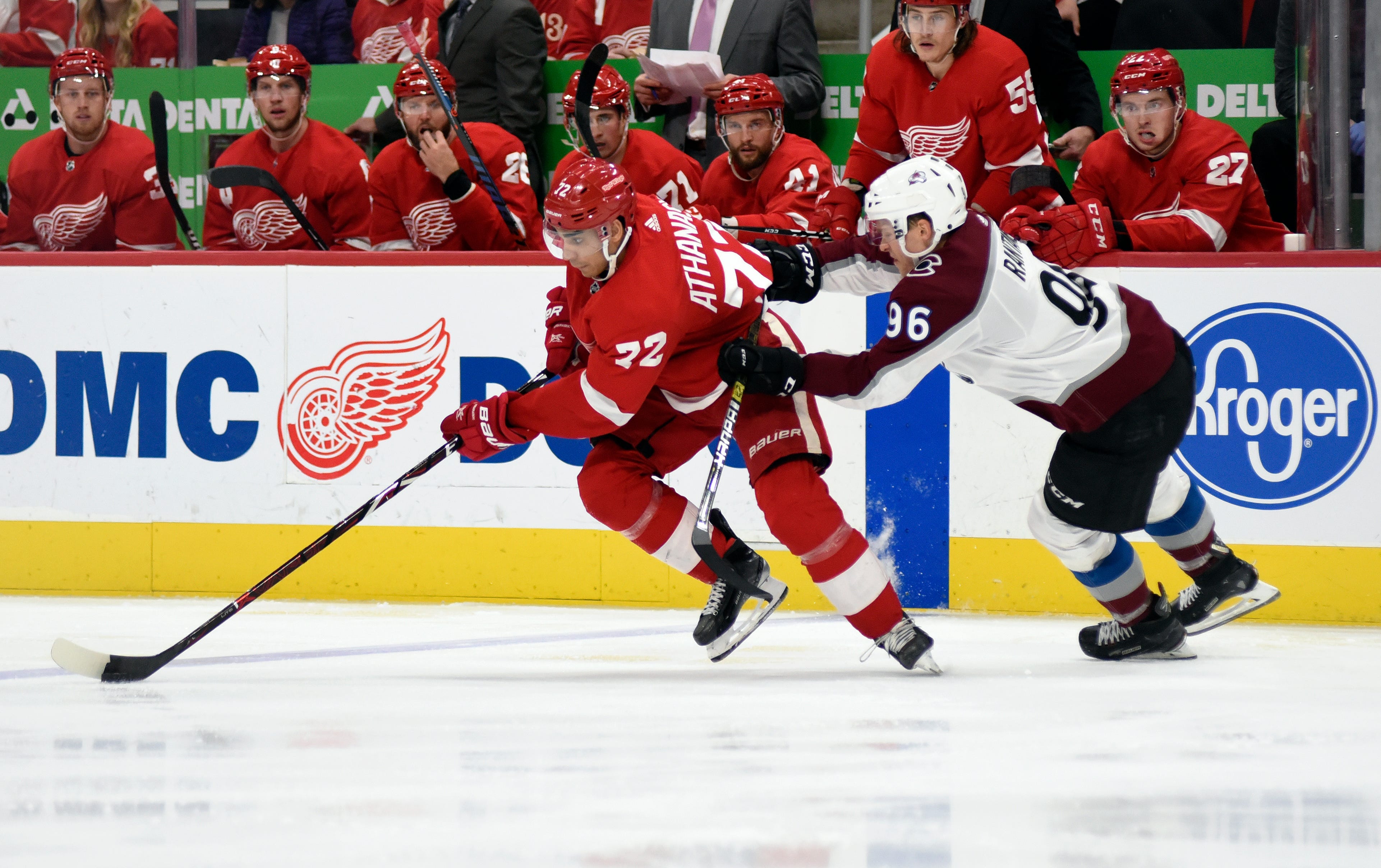 Red Wings center Andreas Athanasiou, left, moves the puck away from Avalanche right wing Mikko Rantanen during the second period.