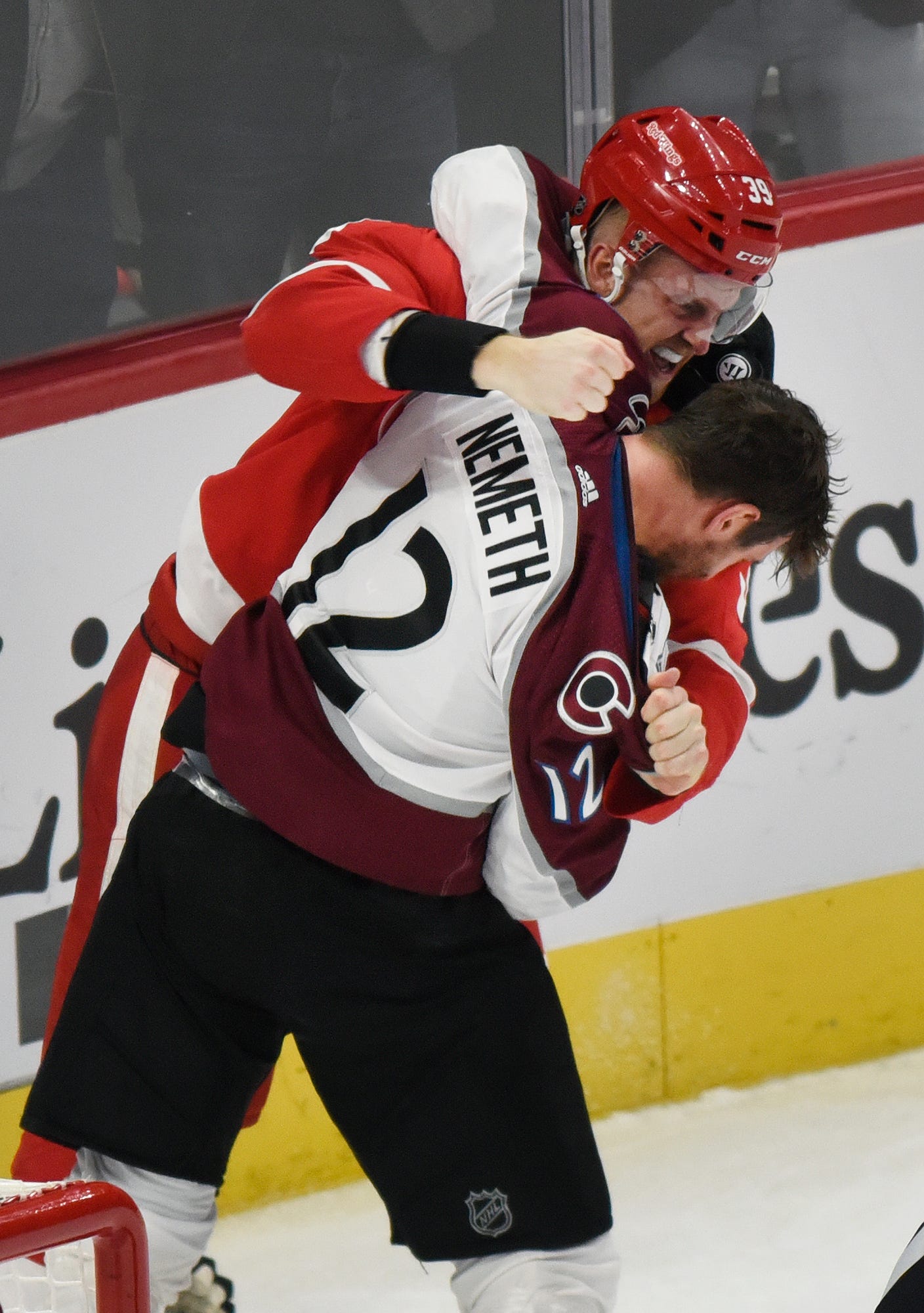 Red Wings' Anthony Mantha fights with Avalanche defenseman Patrik Nemeth during the third period.
