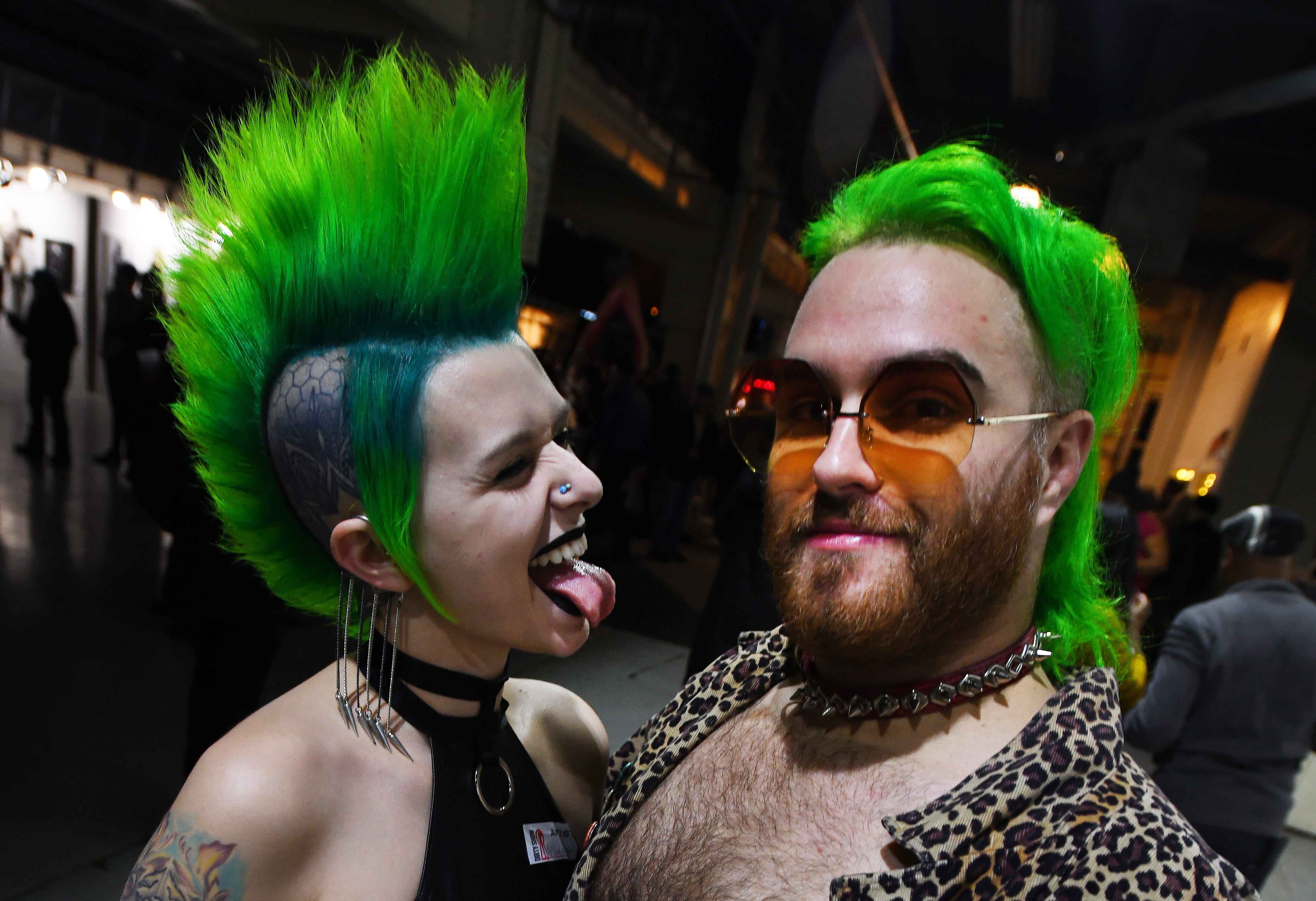 Olivia Dixon and Ignatius Wolf are pretty in green at The Dirty Show.