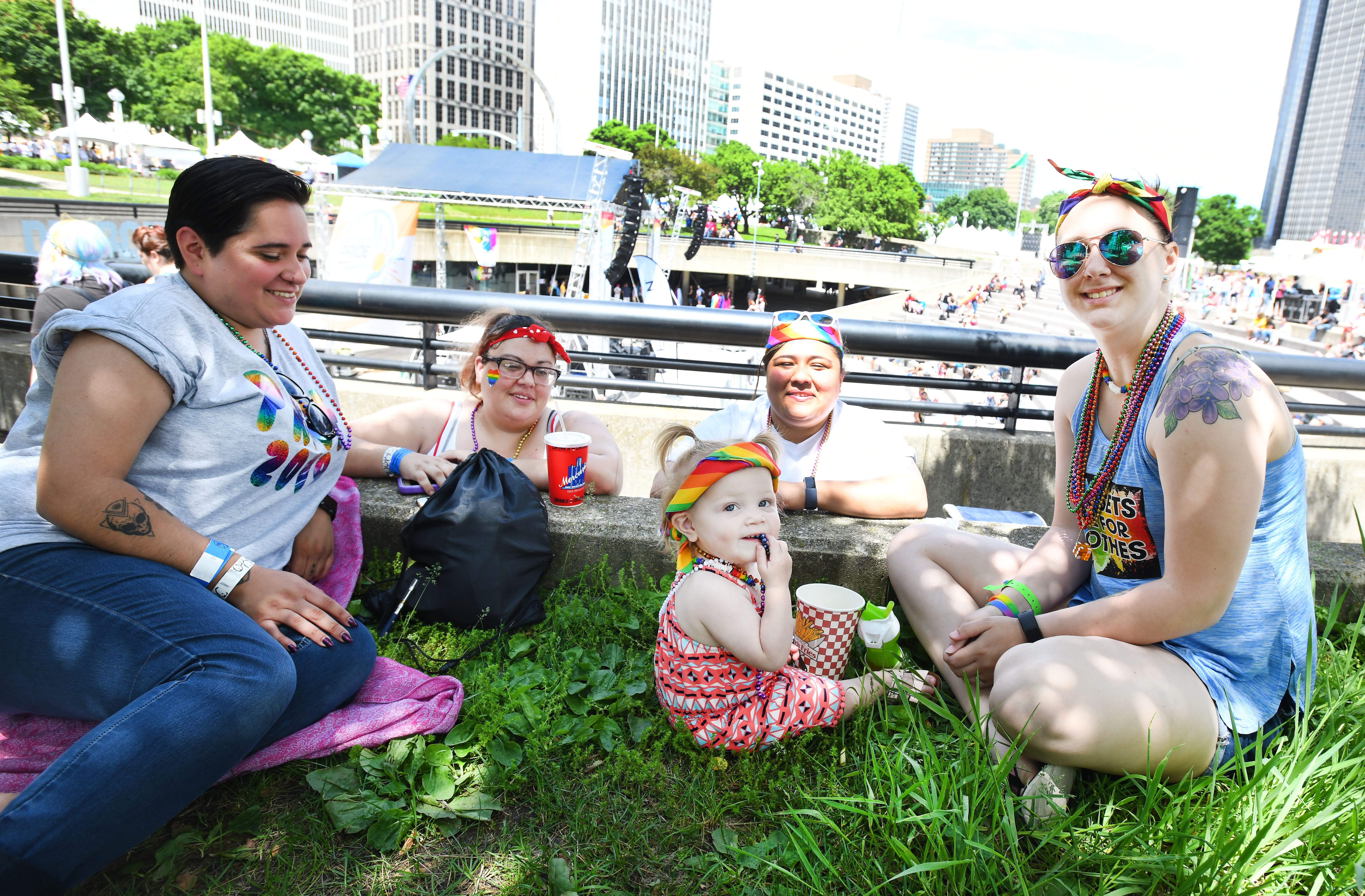 Maria Jones, Stephanie Marshall, Maria Barajs and Ashley Popp with 16 months old Harlee Lett listen to music in Hart Plaza at the Motor City Pride festival.