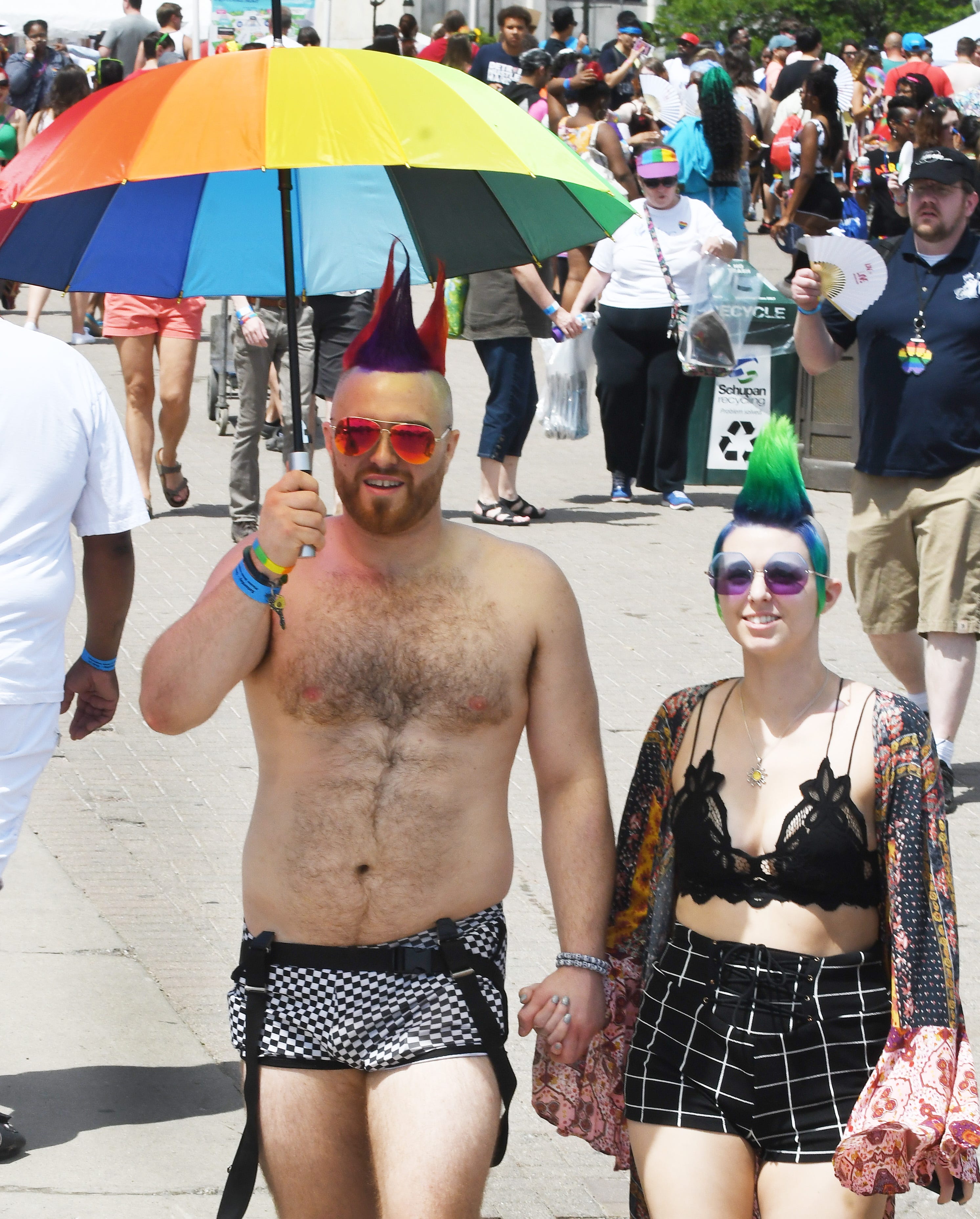 Ignatius Wolf and Olivia Dixon wear their Motor City Pride festival best while strolling through Hart Plaza.