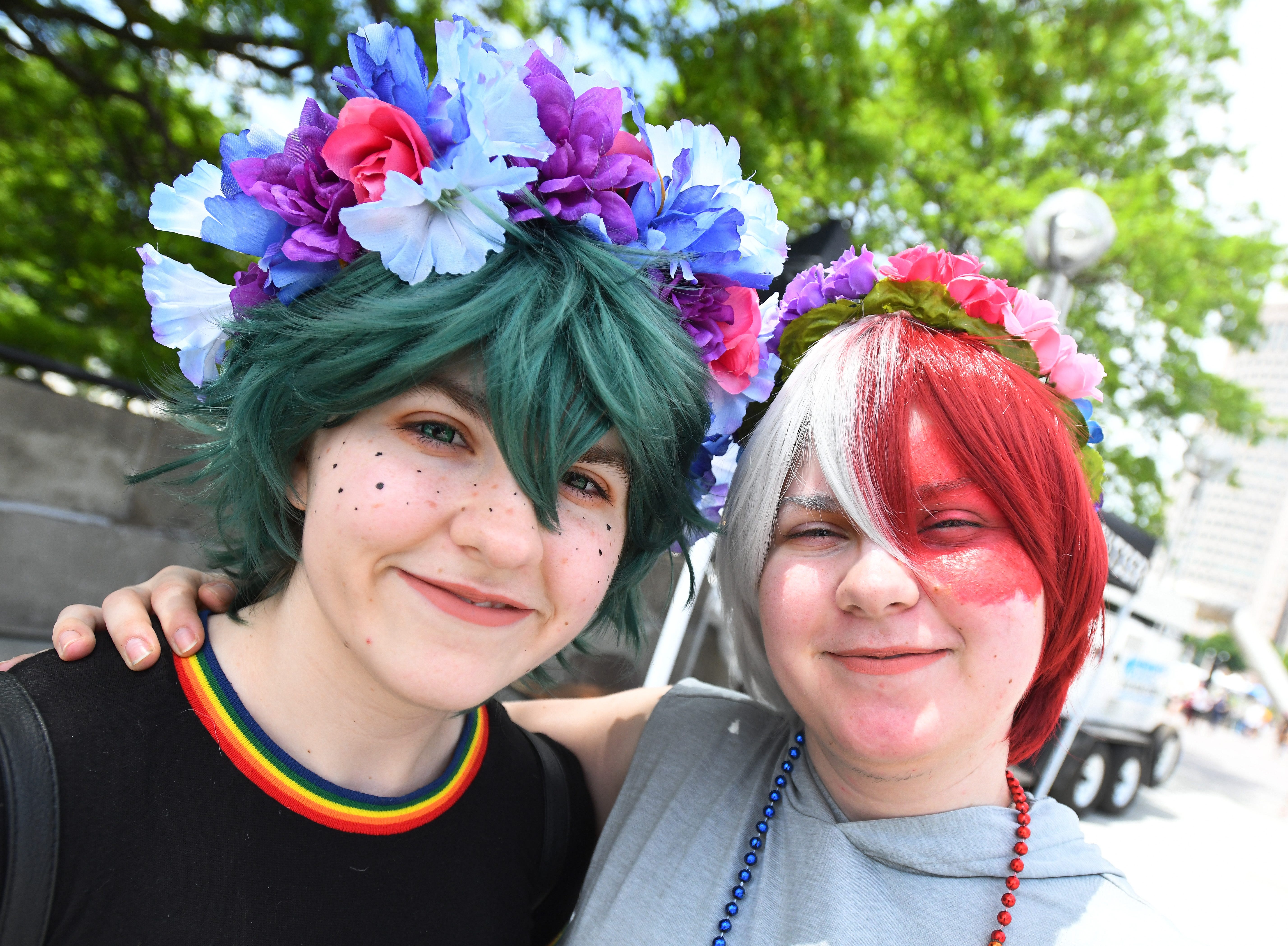 Siblings Alyssa Komlenovich and Miranda Komlenovich of Warren shine in the sunlight over the Motor City Pride festival.