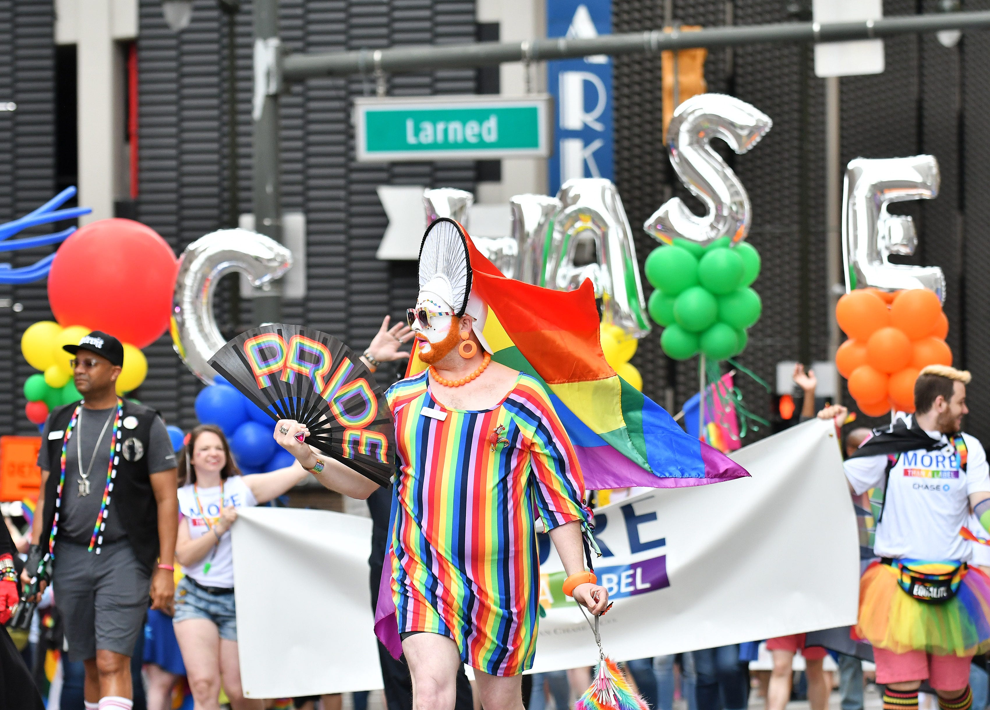 Participants from Chase Bank walk in the  Motor City Pride Parade.