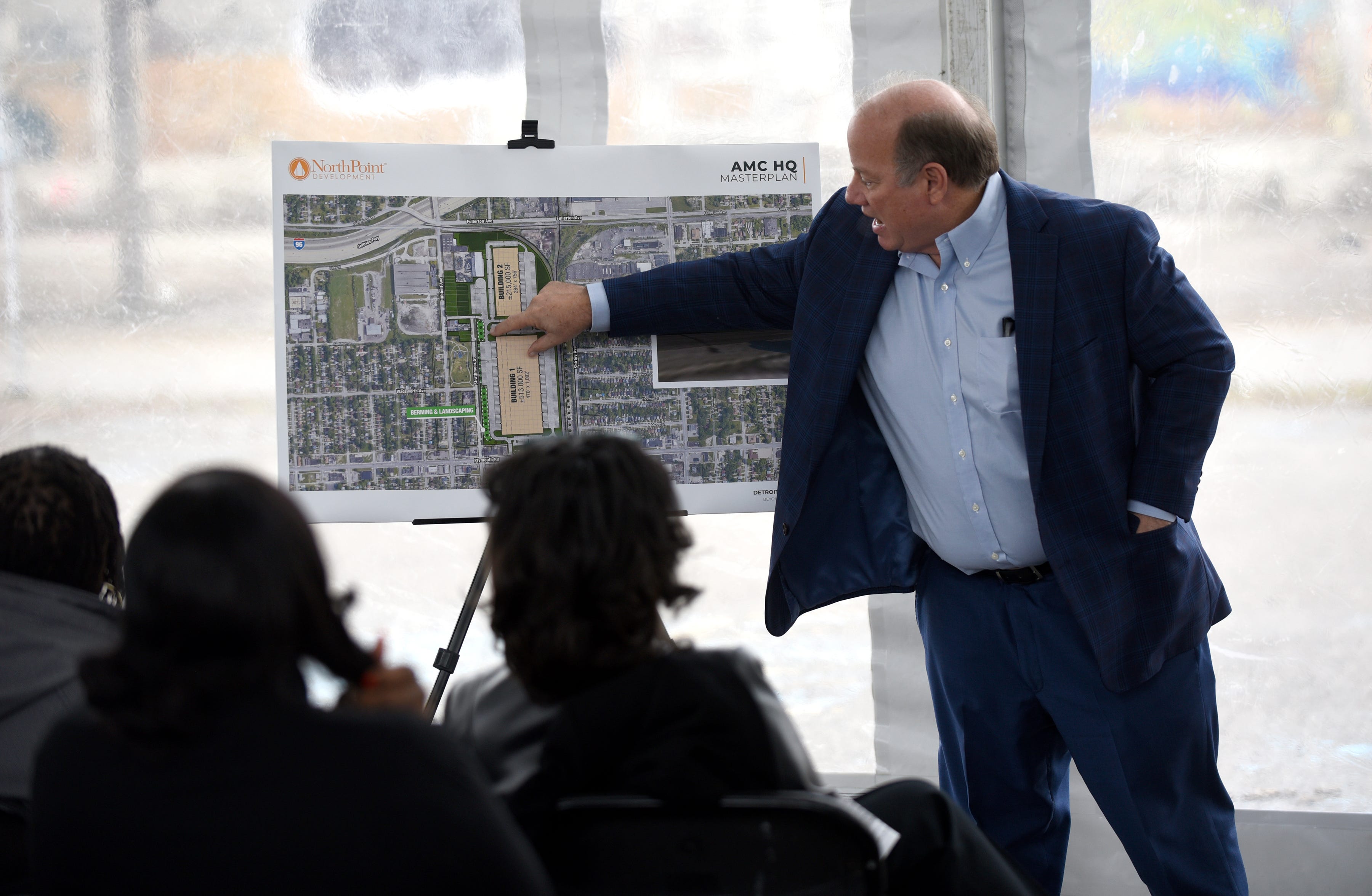 Detroit Mayor Mike Duggan uses a masterplan to make a point as he speaks during a press conference at  the former headquarters of the American Motor Corporation, 14250 Plymouth Road, Detroit, on Thursday, Dec. 9, 2021.