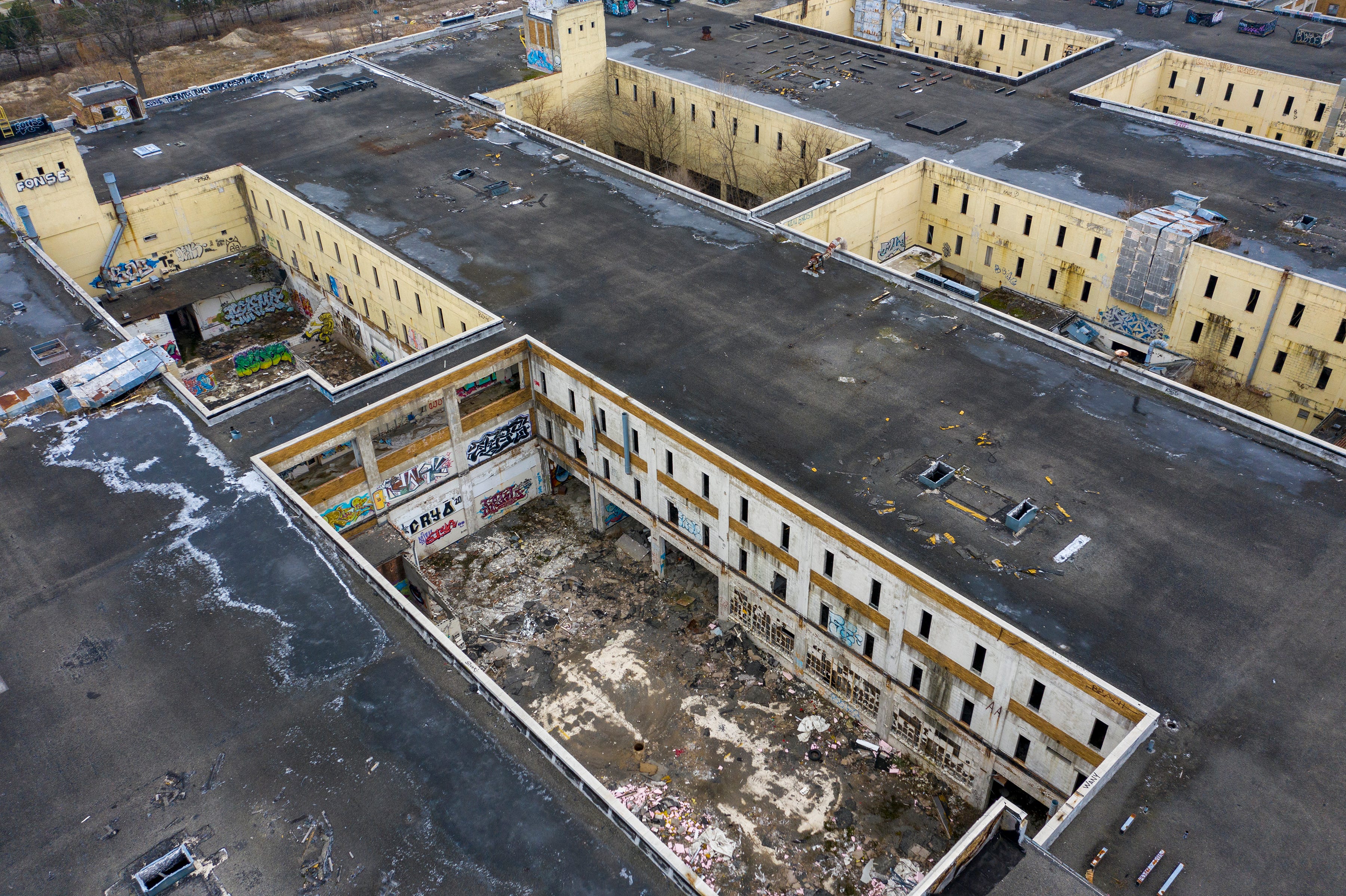 An aerial view of the former American Motor headquarters in Detroit that has sat abandoned since 2010, on Thursday, Dec. 9, 2021. An agreement between NorthPoint Development and the city would sell the city-owned land, including the buildings and 26 residential parcels, to NorthPoint Development for nearly $5.9 million. The company proposes to raze the existing facility and build a new industrial complex suitable for an automotive supplier.