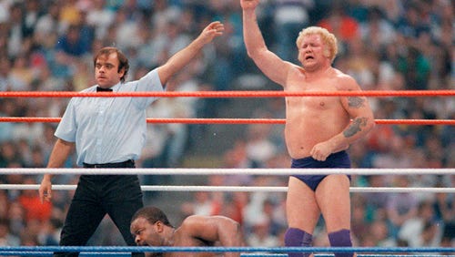 "King" Harley Race celebrates his victory over the Junkyard Dog.