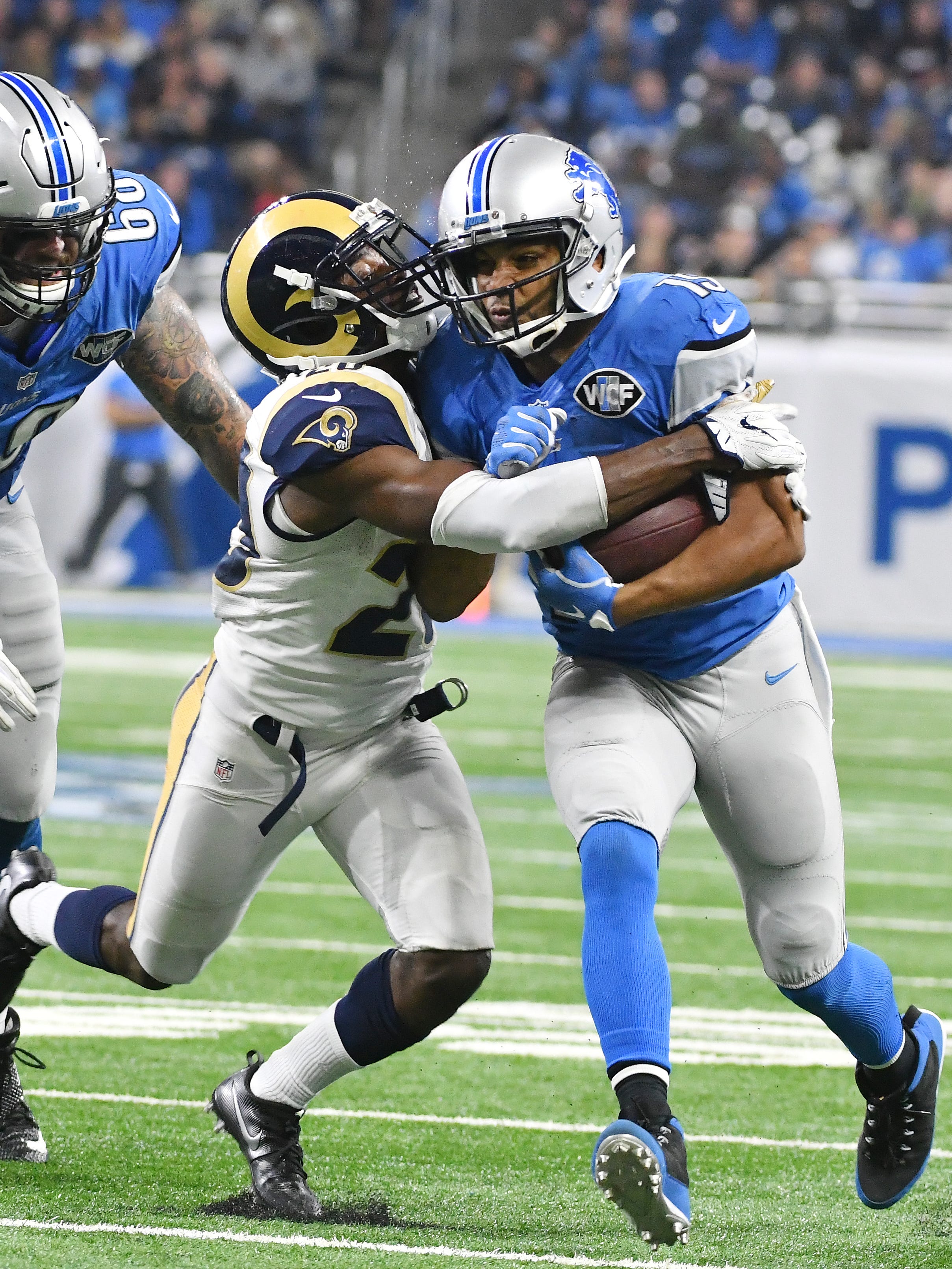 Lions wide receiver Golden Tate runs just short of a first down late in the fourth quarter with Rams Lamarcus Joyner eventually bringing him down.
