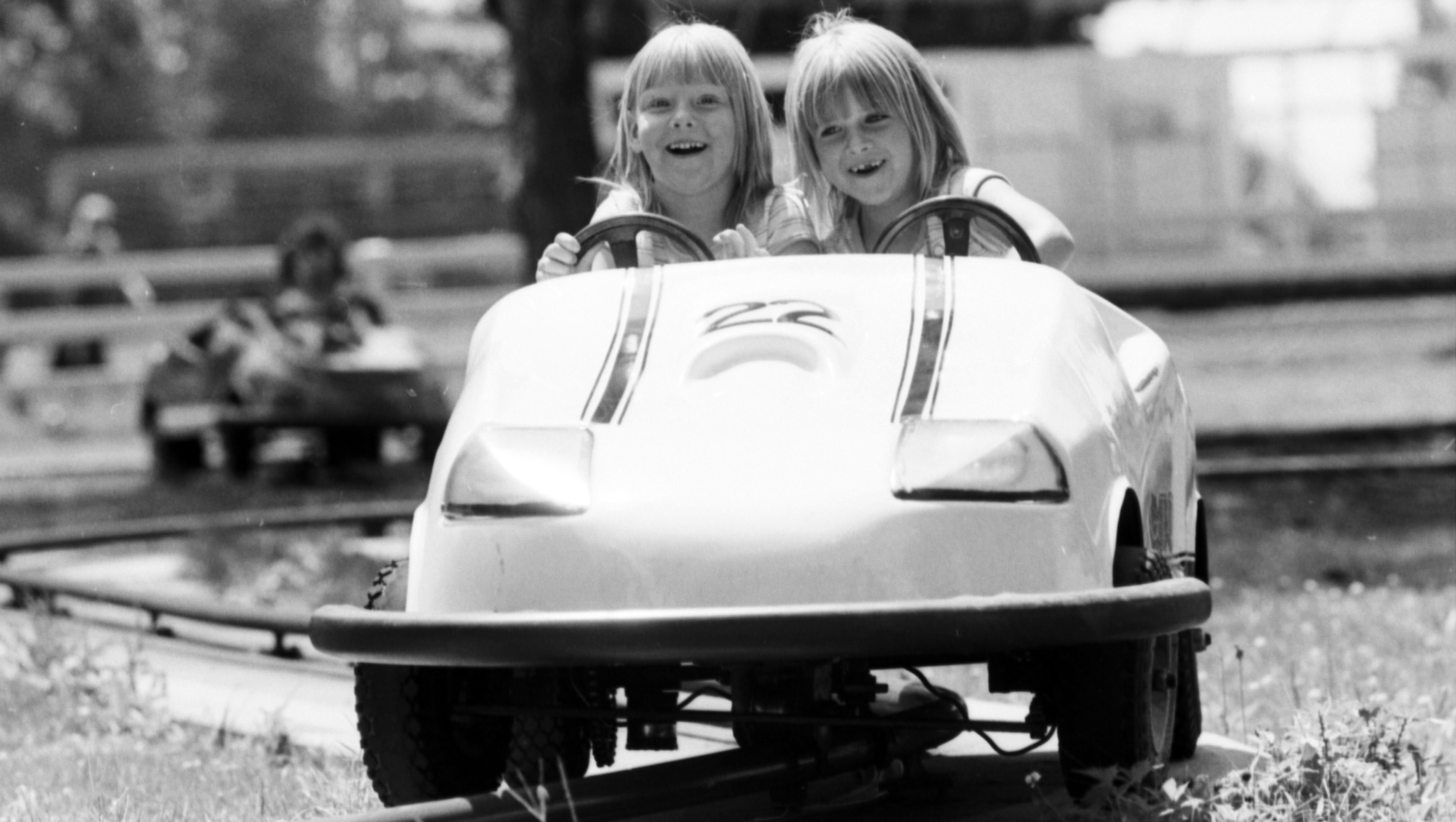 Two young  girls enjoy one of the Boblo rides in 1981.