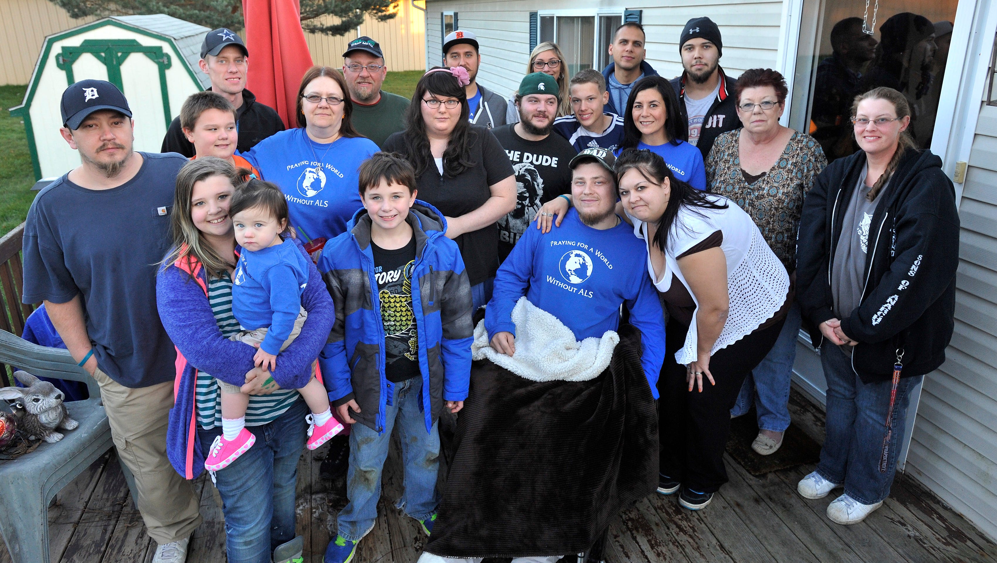 The Gutheries and extended family members gather on the porch after a Sunday family meal at Sallie Gutherie's home.