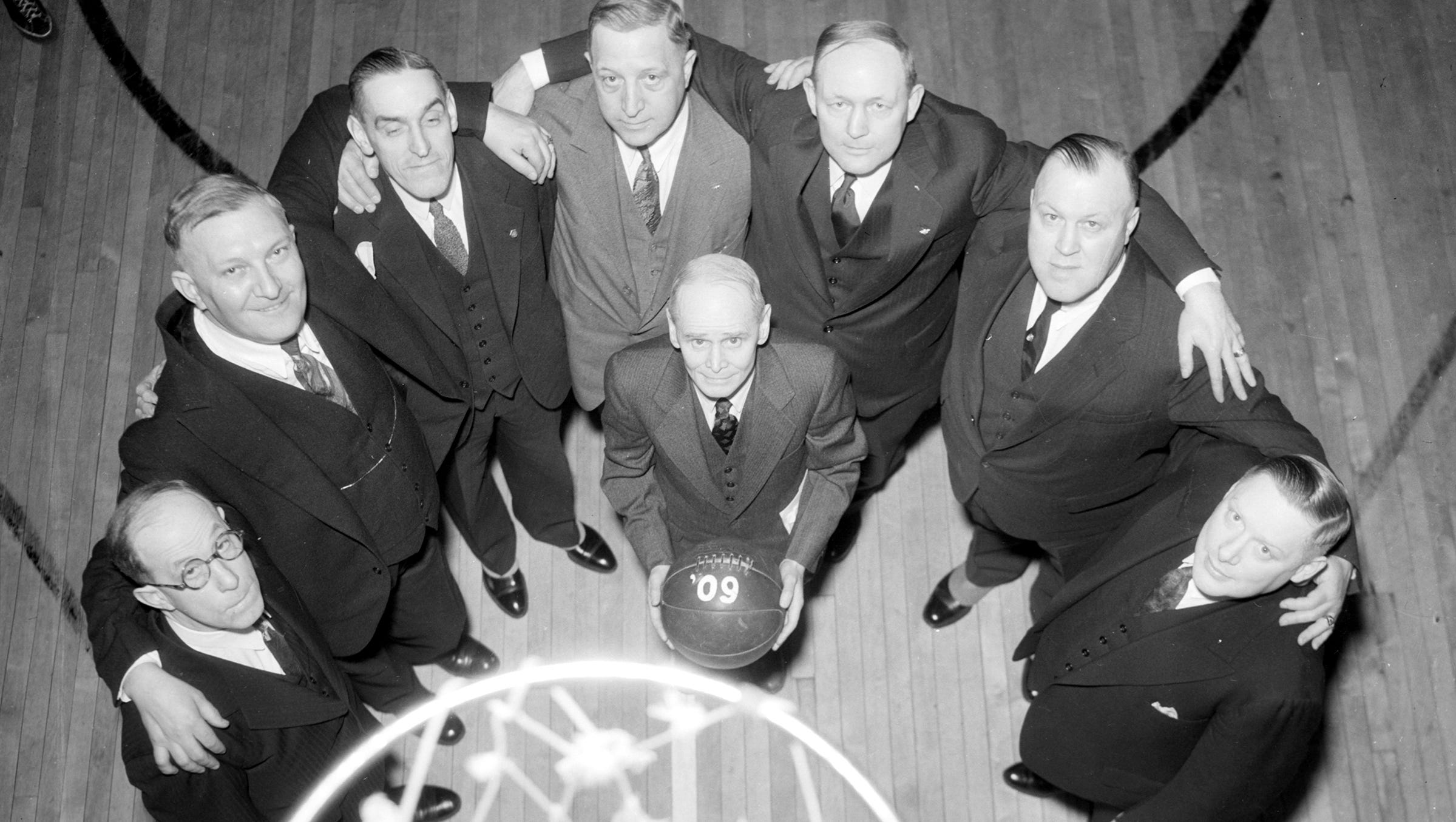 The most popular classes at the YMCA were targeted at businessmen. William N. Gray holds the ball for a Detroit YMCA basketball team in 1909.  From left: Dr. George Hanna, Bernard Johnson, Roy Boosey, Chan Johnson, Gailey Stockham, Al G. Huebner and Ernie Wilson.