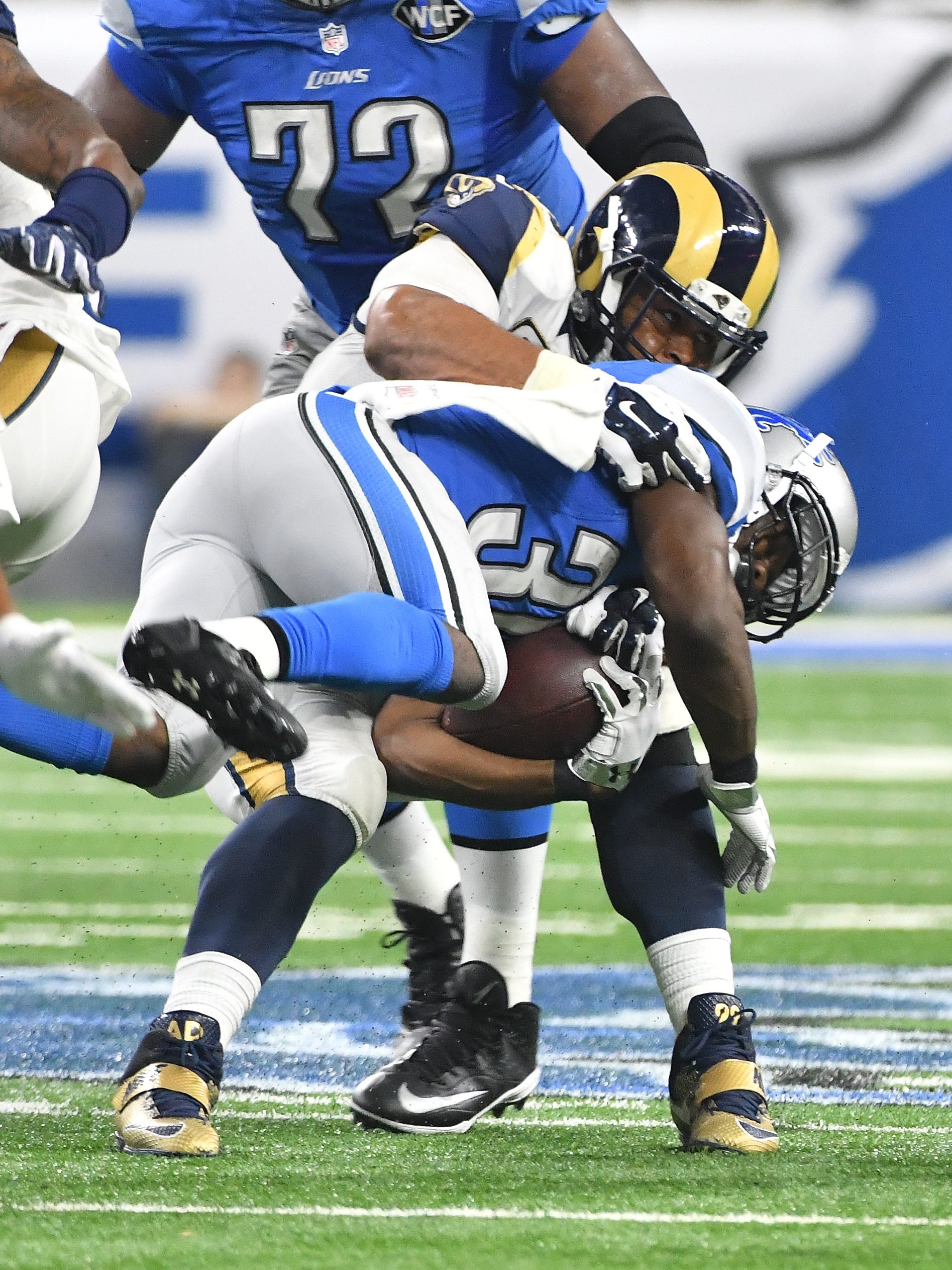 Rams Aaron Donald slams Lions running back Justin Forsett to the turf in the fourth quarter.