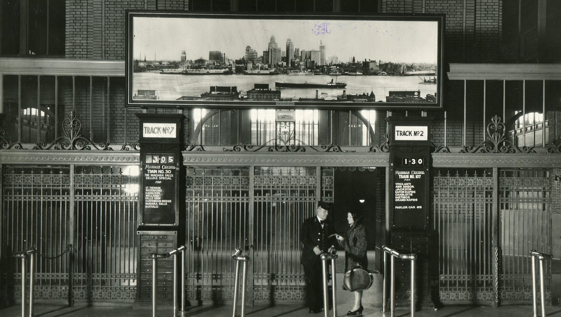 Gates lead from the concourse to the tracks at Michigan Central Depot. The 16-by-5-foot picture of the Detroit skyline was given to Michigan Central by The Detroit News on Feb. 23, 1930.