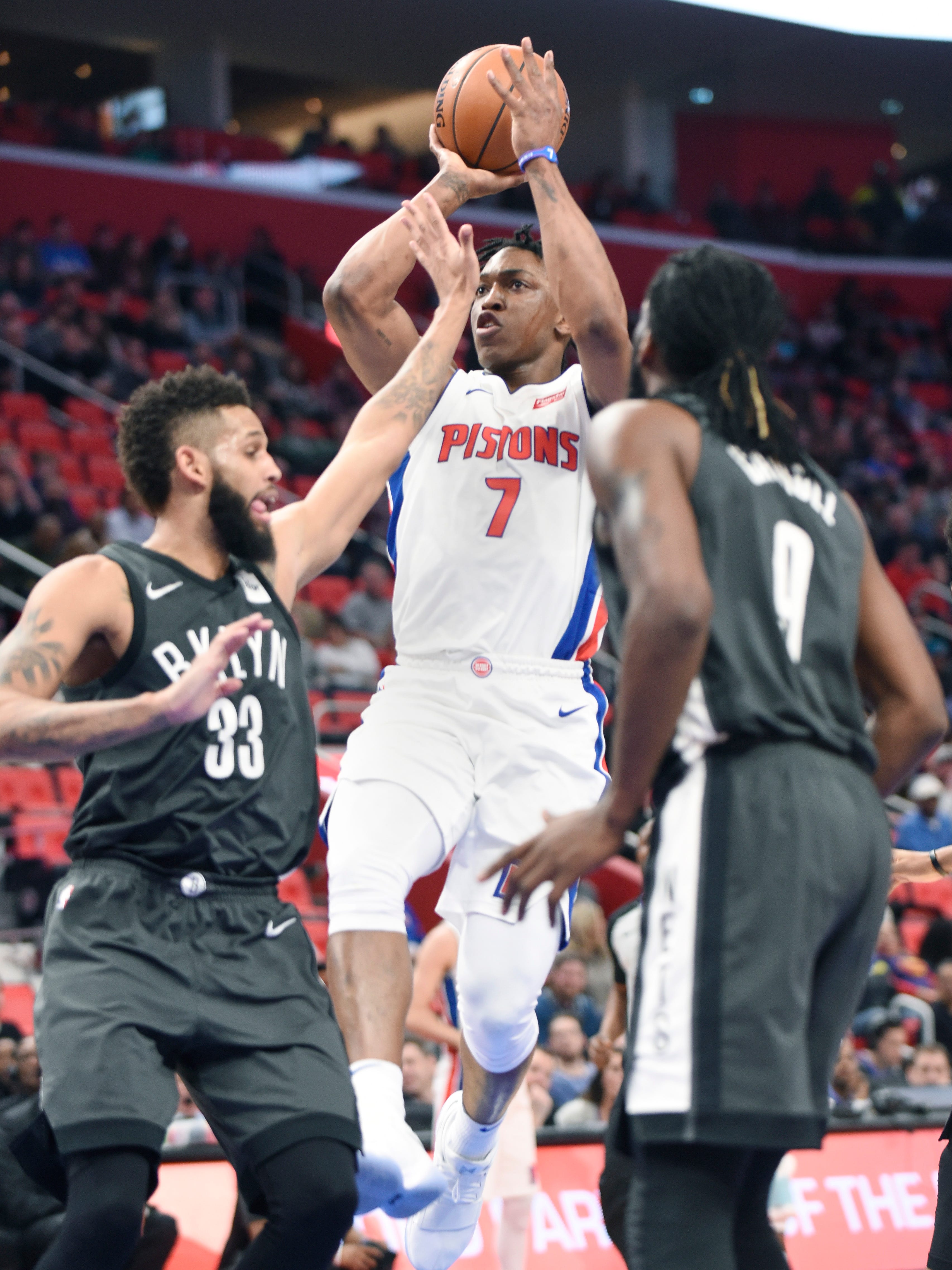 Pistons' Stanley Johnson scores over the Nets' Allen Crabbe in the fourth quarter. Johnson had 19 points and two rebounds.