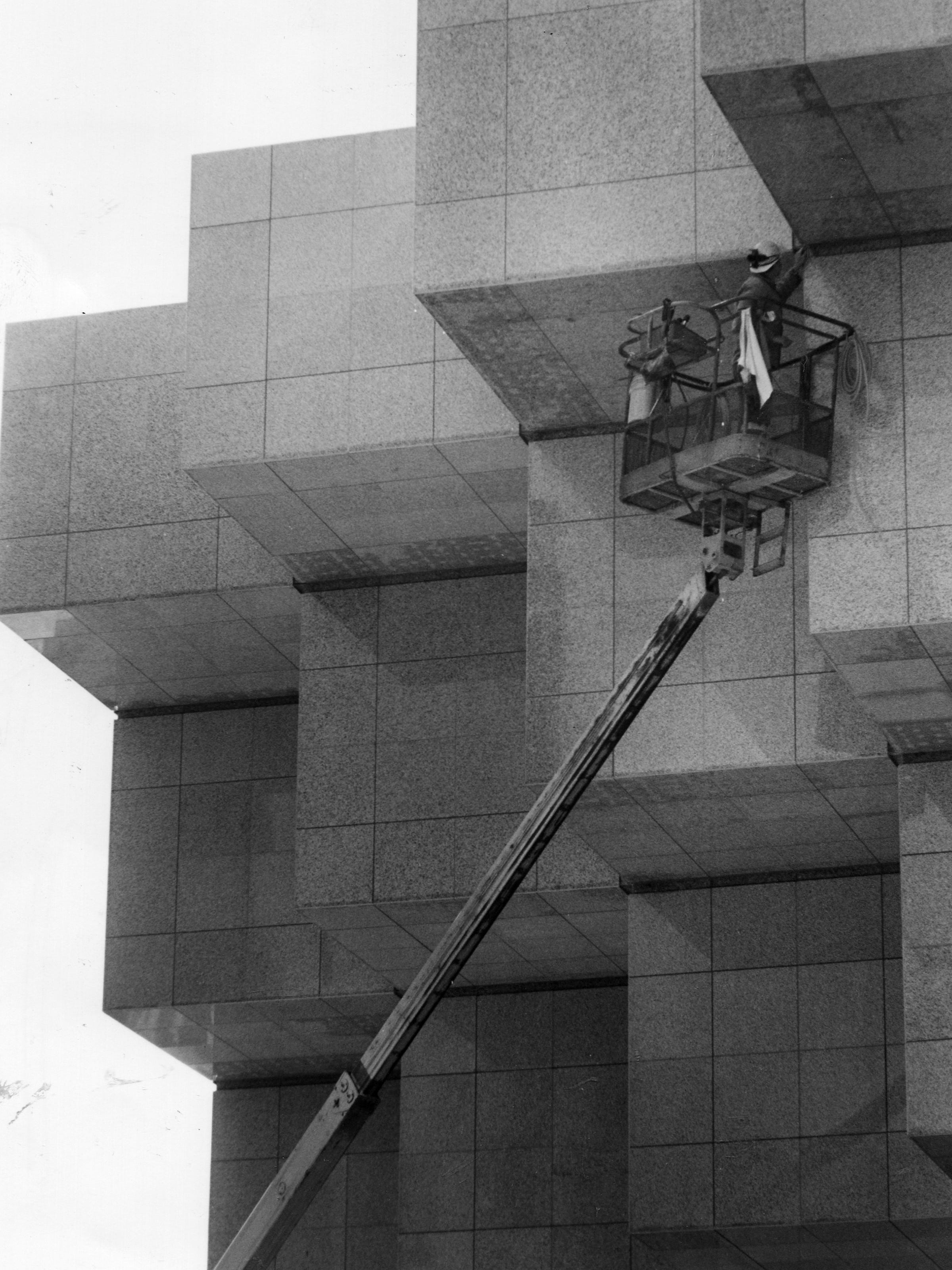 Workers finish Cobo's exterior facade on Oct. 13, 1988.