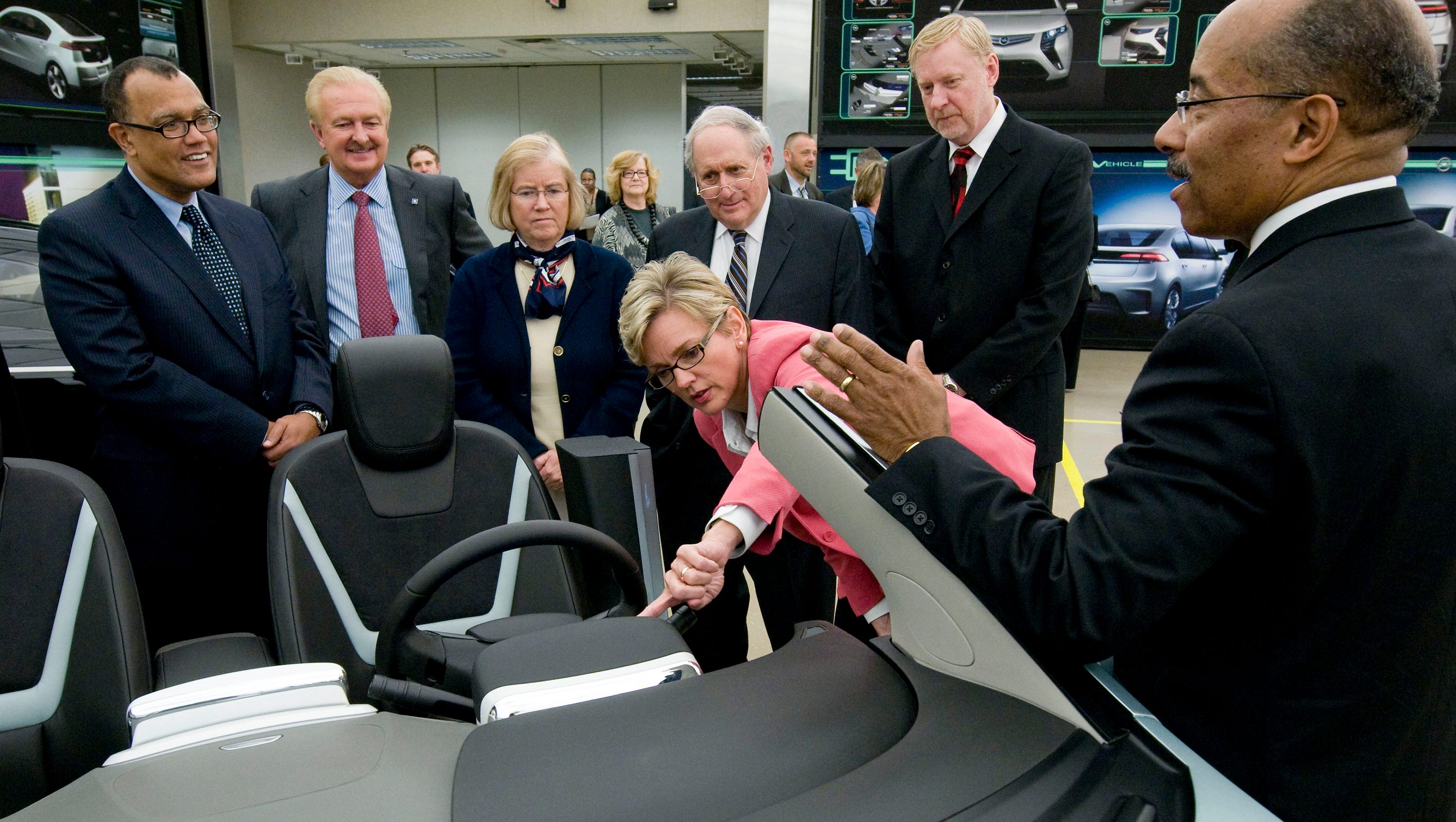 President Obama's auto czar Ed Montgomery, left,   looks on with GM's Gary Cowger, Michigan Rep. Candice Miller, U.S. Sen. Carl Levin, GM's Tom Stephens and Michigan Gov. Jennifer Granholm as GM Vice President Global Design Ed Welburn gives a tour of the Chevrolet Volt Studio at General Motors Design Friday, May 8, 2009 in Warren.