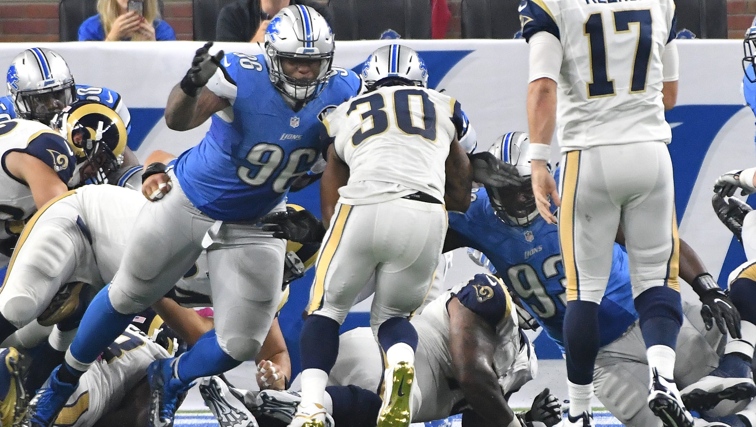 Lions Stefan Charles and Tyrunn Walker have Rams running back Todd Gurley in their sights, stopping the Rams on 4th and 1 to end the second quarter tied at 14.