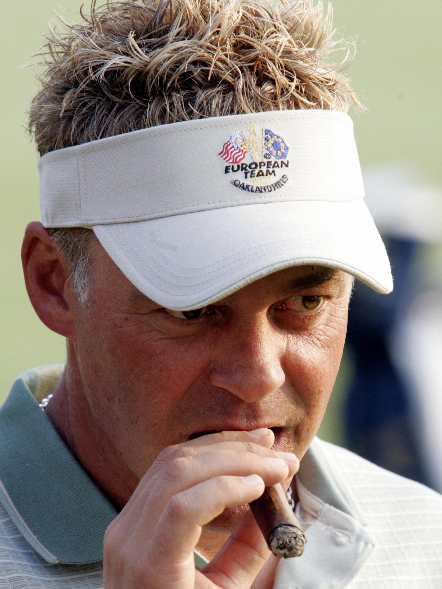 Team Europe's Darren Clarke takes a puff of his cigar during the 2004 Ryder Cup at Oakland Hills.