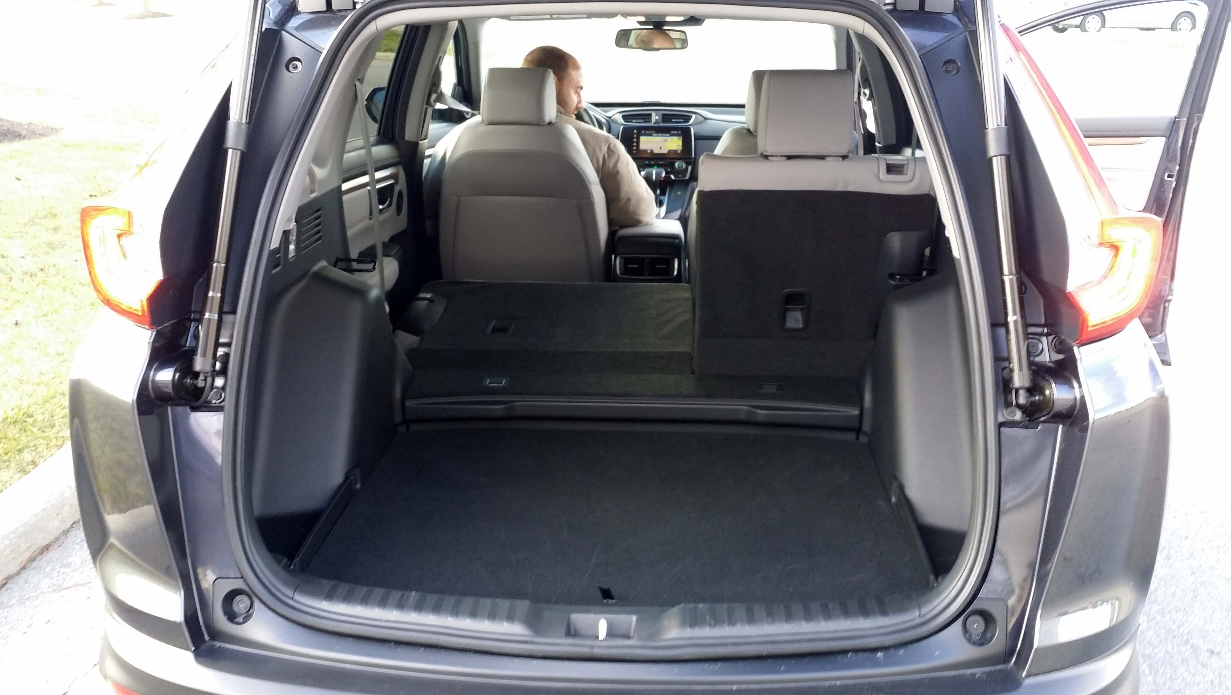 The new, 2017 Honda CR-V comes equipped with rear seats that fold flat and a "shelf" rear storage compartment.