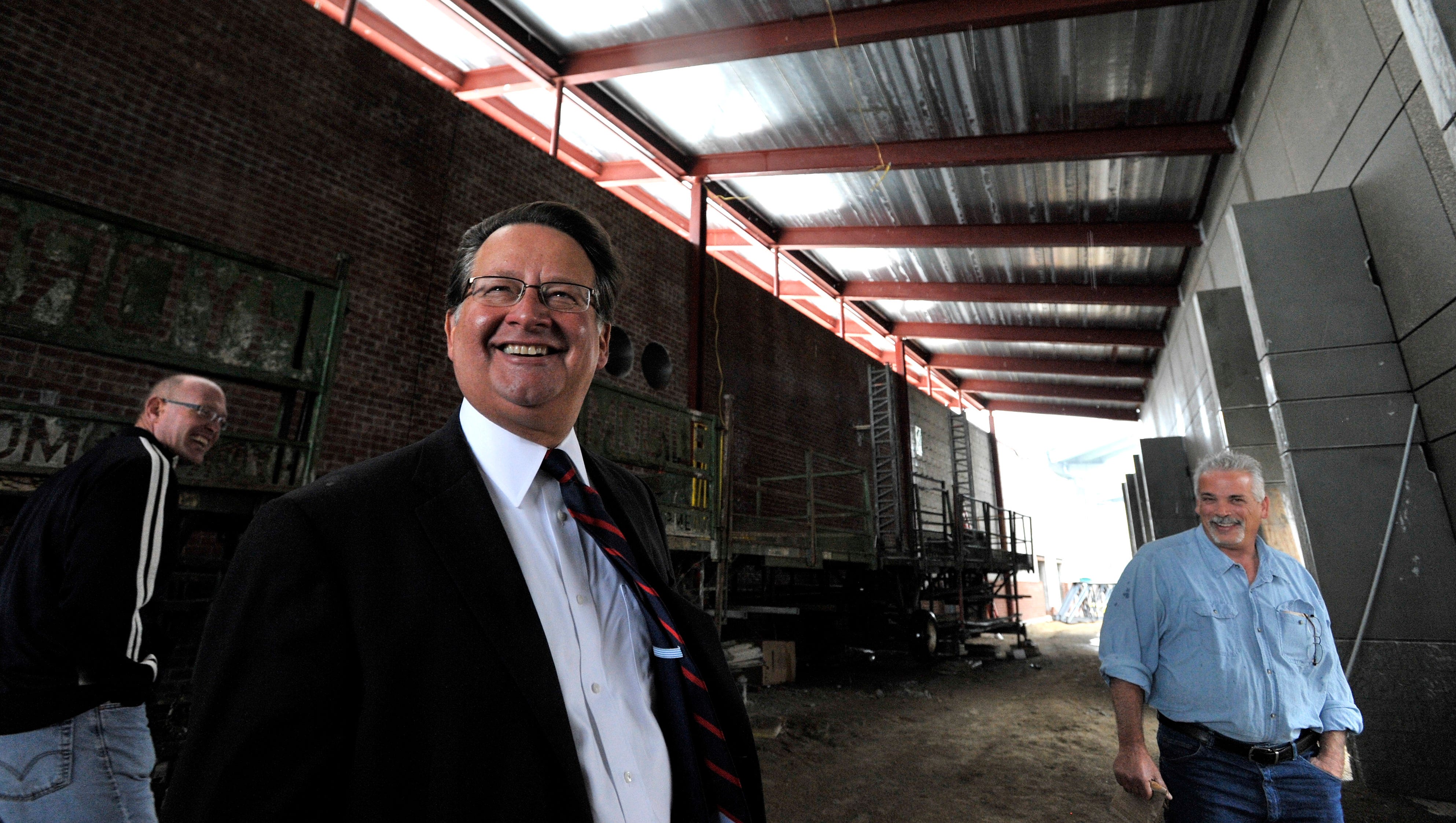 U.S. Congressman Gary Peters, center, shares a laugh with St. Clair County Board Chairman Jeff Bohm, left, and Orion Construction project manager Ed Simeone, right, of Clarkston, as they stand in the "pre-function area" of the convention center.
