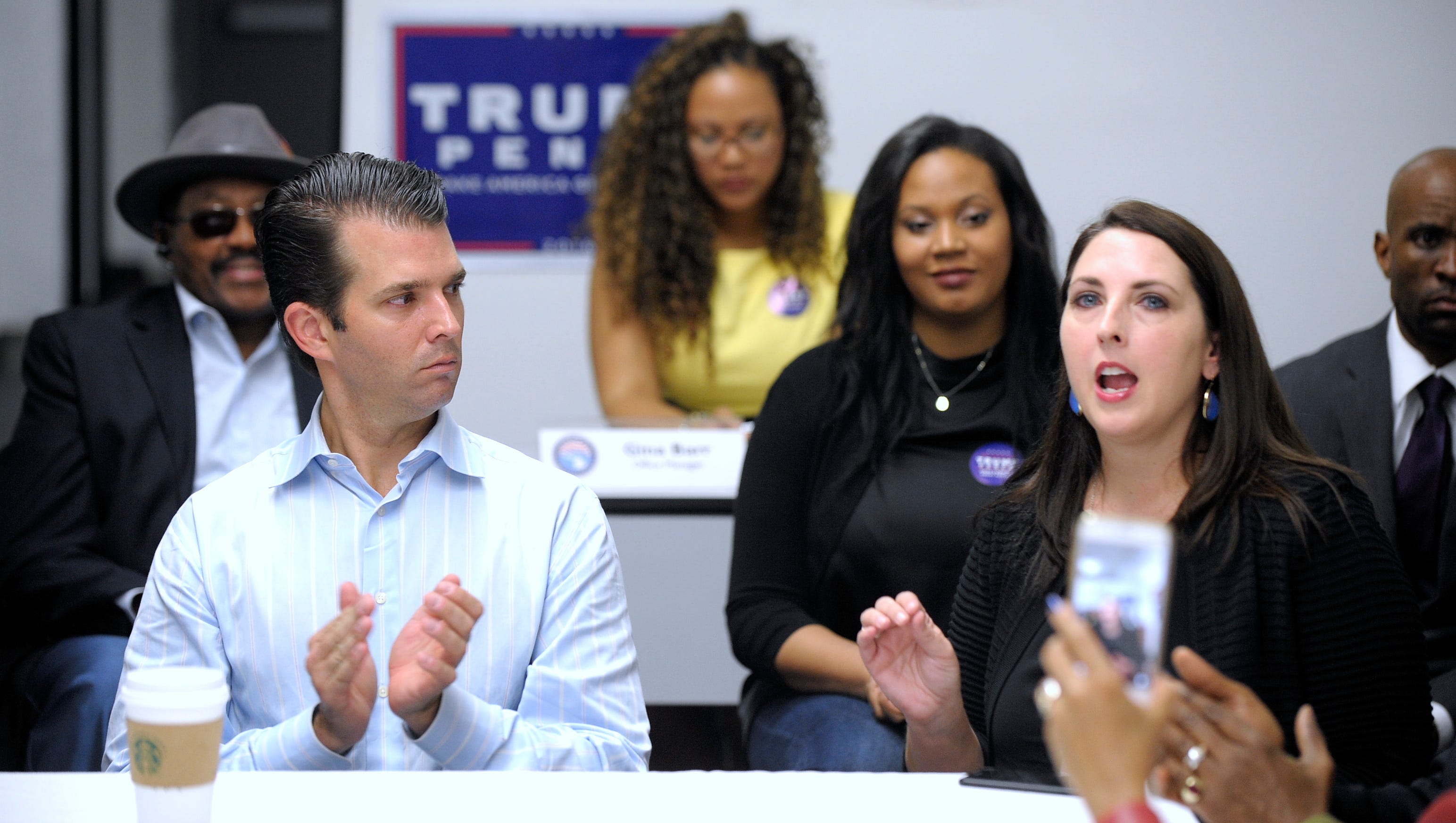 Ronna Romney McDaniel, right, Michigan Republican Party chairman, talks during the event as Donald Trump Jr., left, claps.