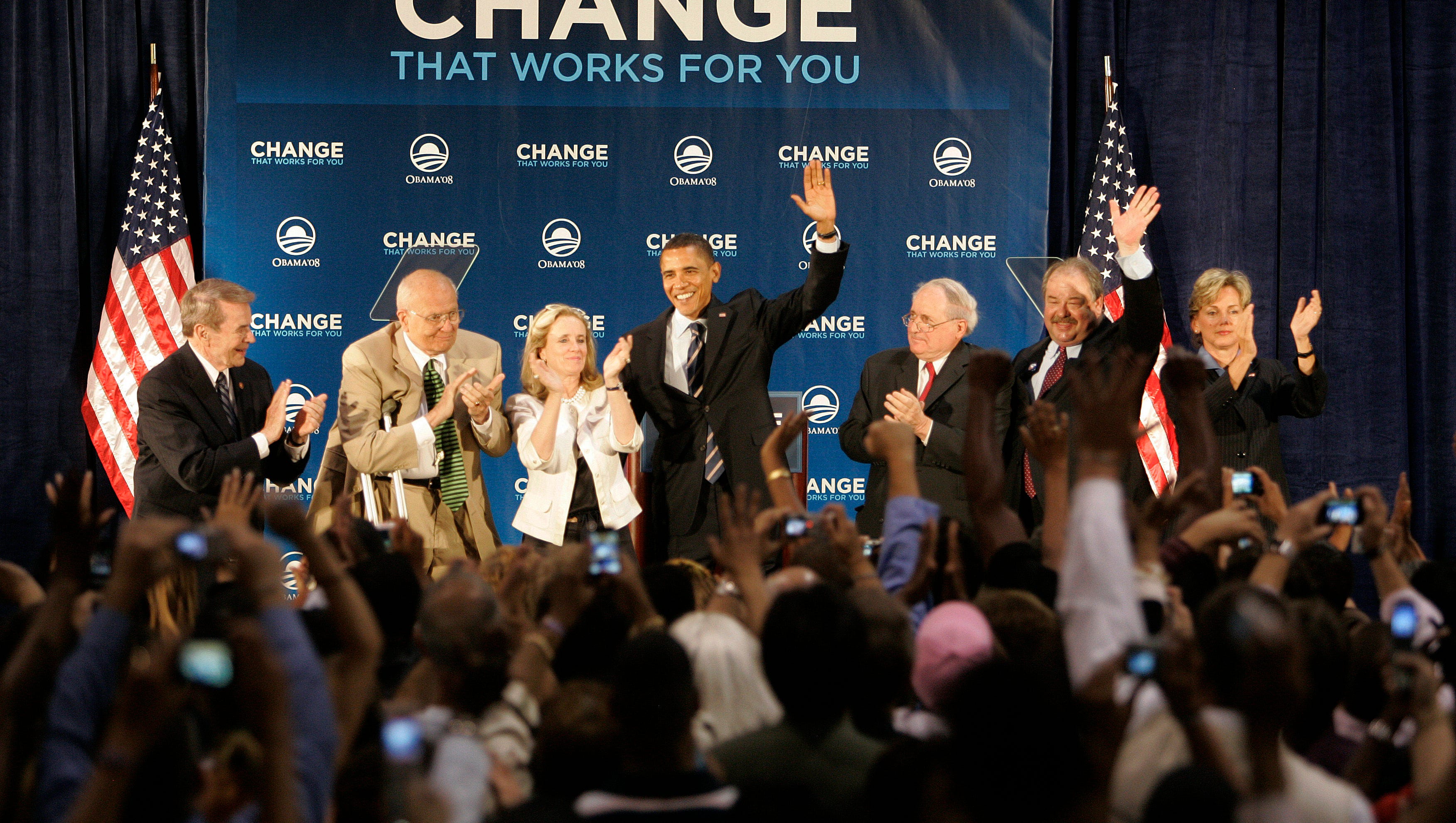 Democratic presidential candidate Barack Obama speaks to a crowd at Kettering University in Flint on June 16, 2008, with, from left, Rep. Dale Kildee, Rep. John Dingell and his wife Debbie Dingell, Sen. Carl Levin, Michigan Lt. Gov John Cherry and Gov Jennifer Granholm.