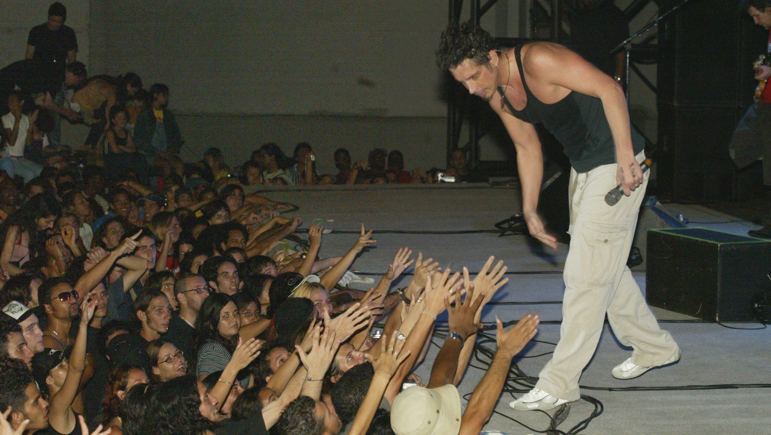 Chris Cornell interacts with the audience during an Audioslave performance in Havana, Cuba, May 6, 2005. AudioSlave gave what was billed as Cuba's first outdoor rock concert by a U.S. band since 1959.