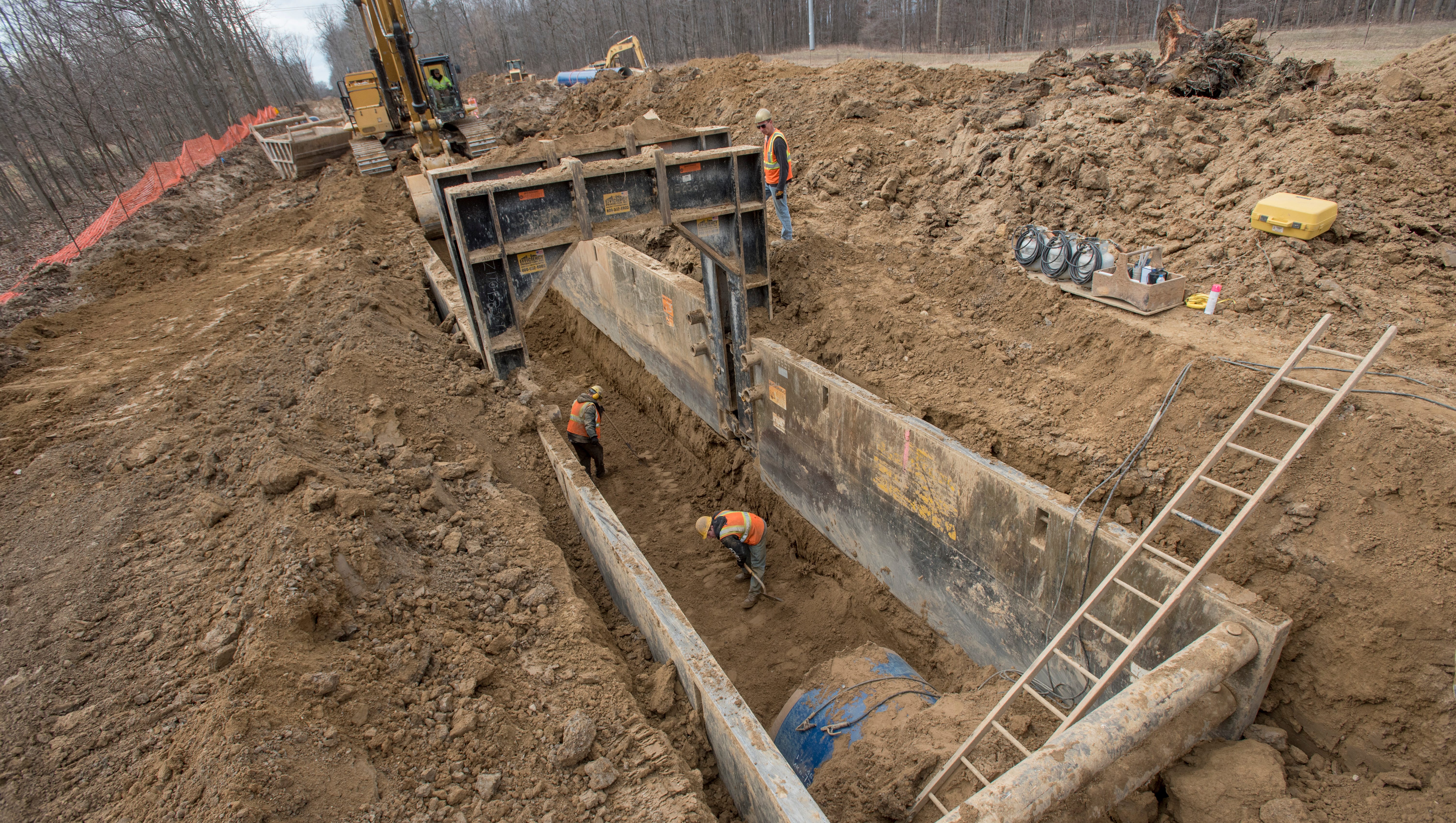 Laborers work in a ditch preparing the ground for a section of the Karegnondi Water Authority pipeline.