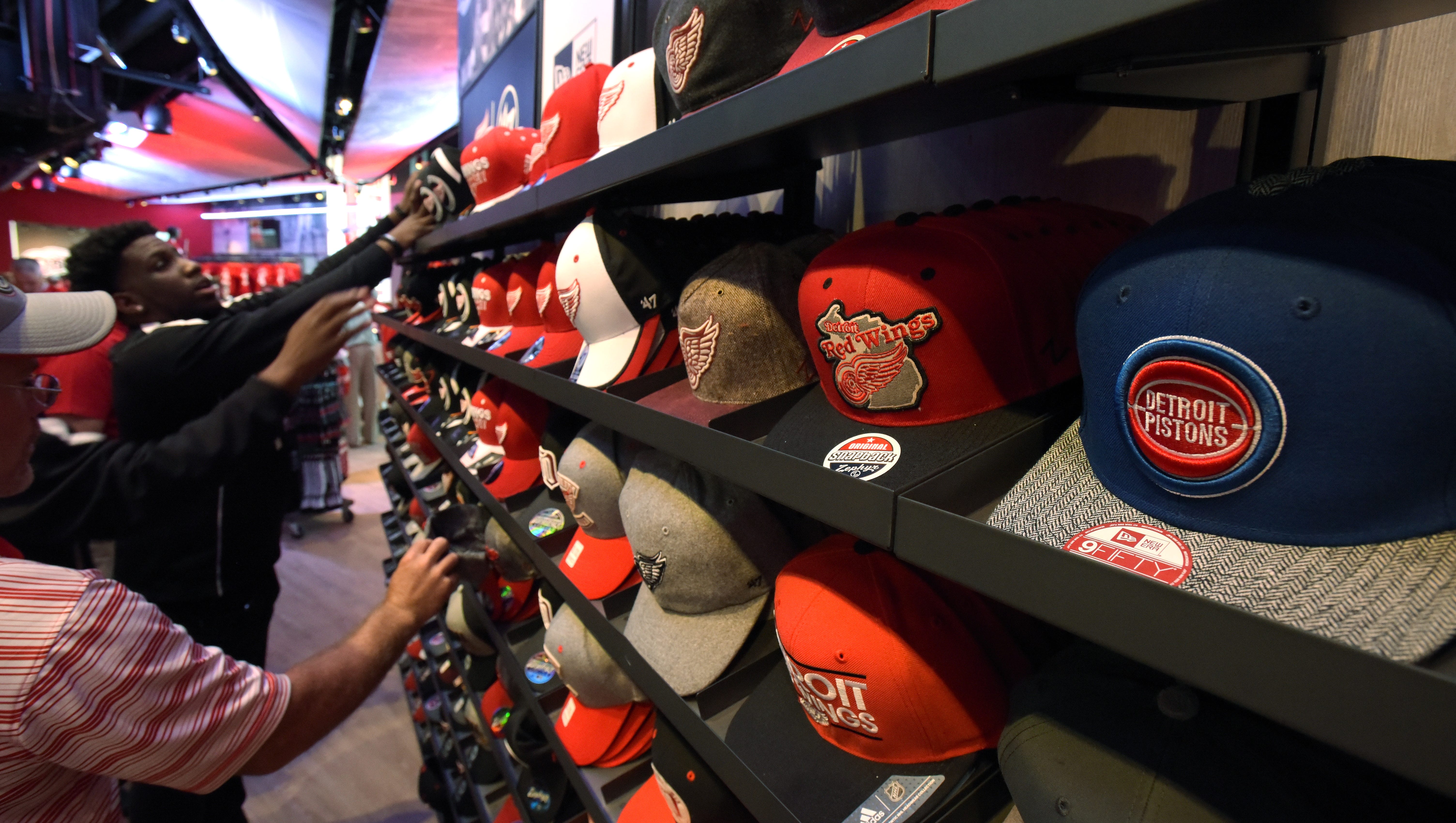 Fans check out Detroit Red Wings and Detroit Pistons in the main merchandise store.