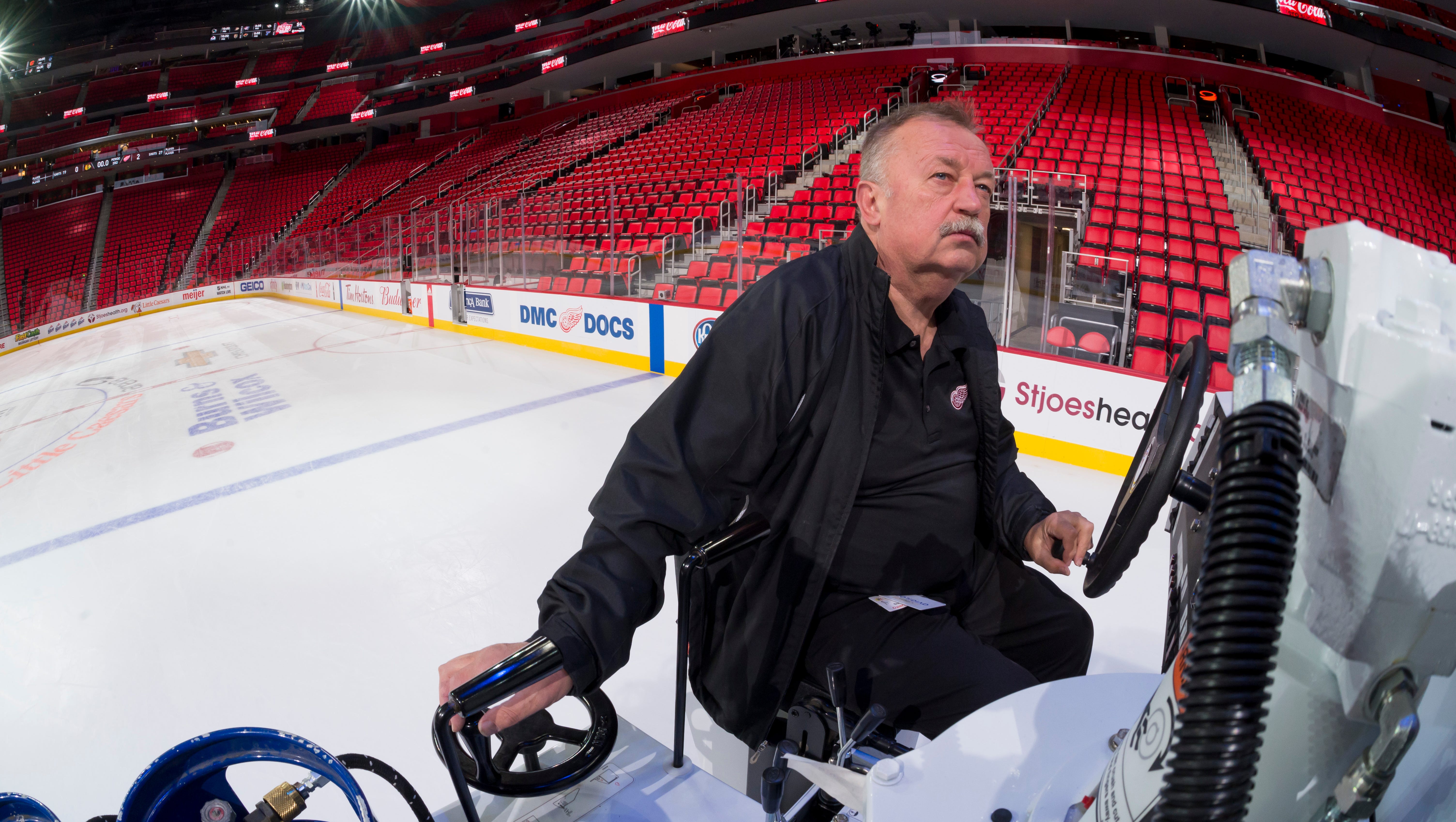 Al Sobotka, building operations manager for Olympia Entertainment, drives the zamboni to resurface the ice before a Red Wings preseason game at Little Caesars Arena.
