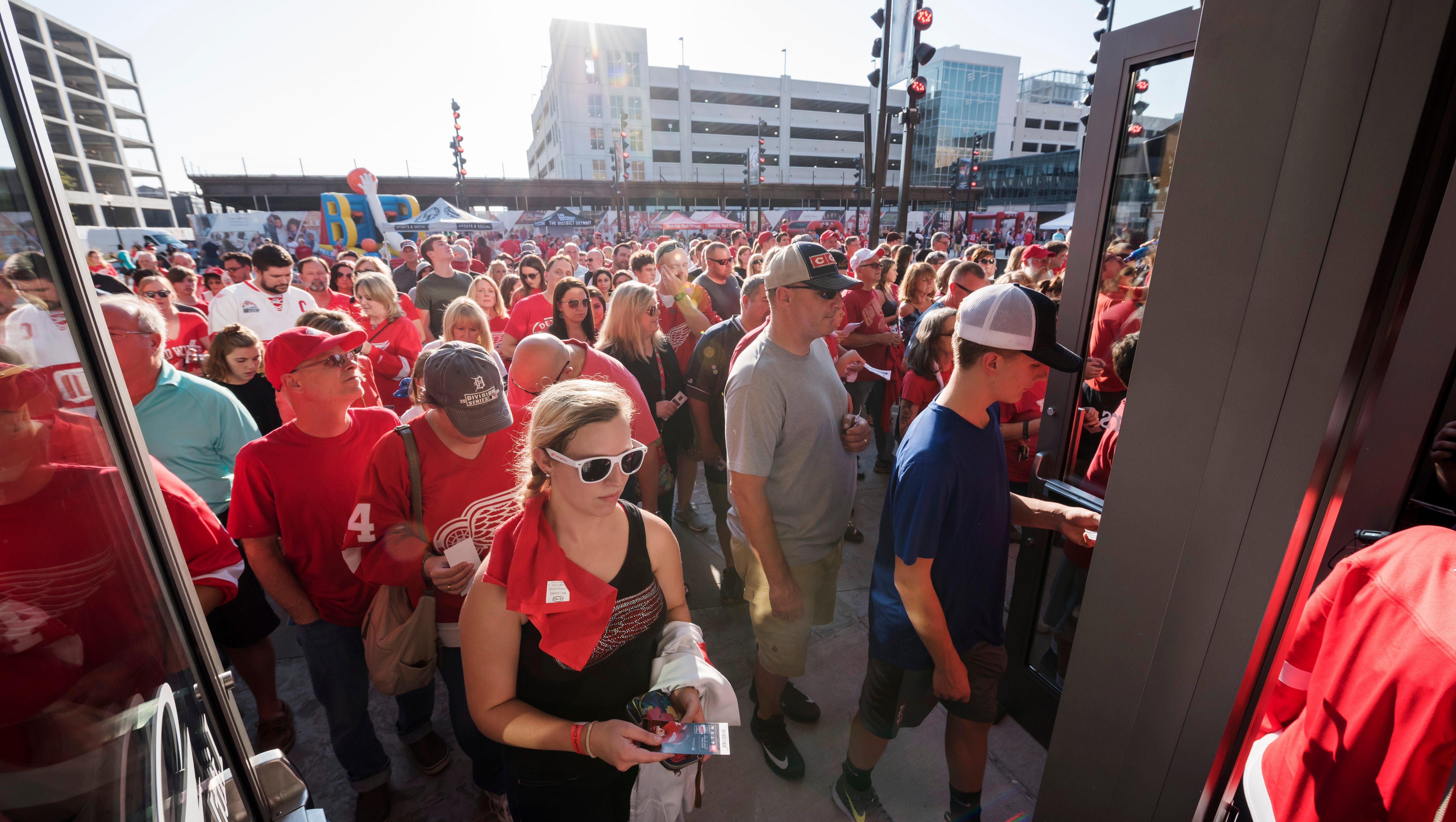 Red Wings fans stream into the Little Caesars Arena for the first-ever hockey game played there, a preseason game against the Boston Bruins stadium.