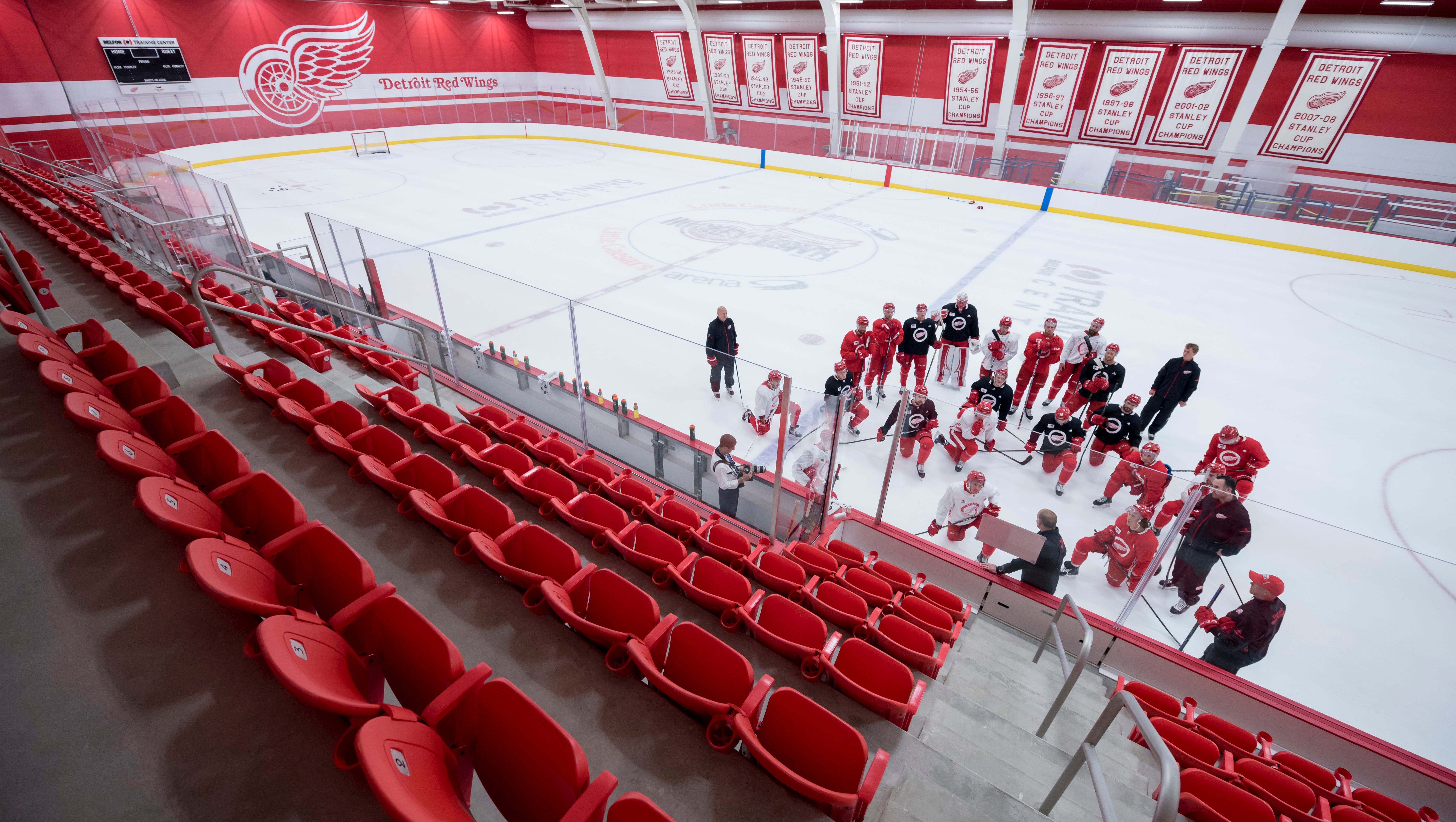 Detroit head coach Jeff Blashill goes over plays during practice on the practice rink inside Little Caesars Arena.