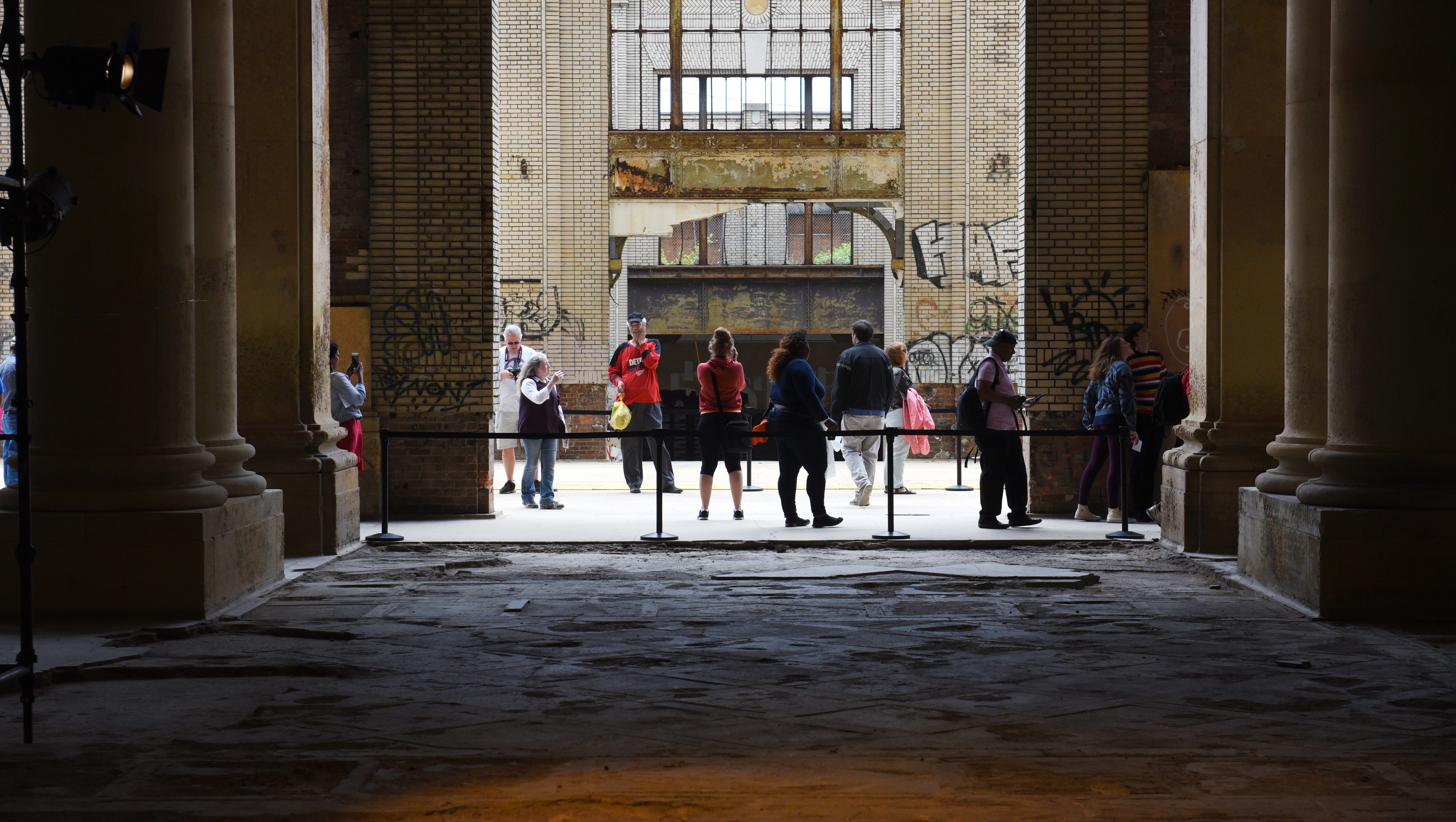 People enter the Michigan Central Train Depot during an open house on Friday in Detroit.