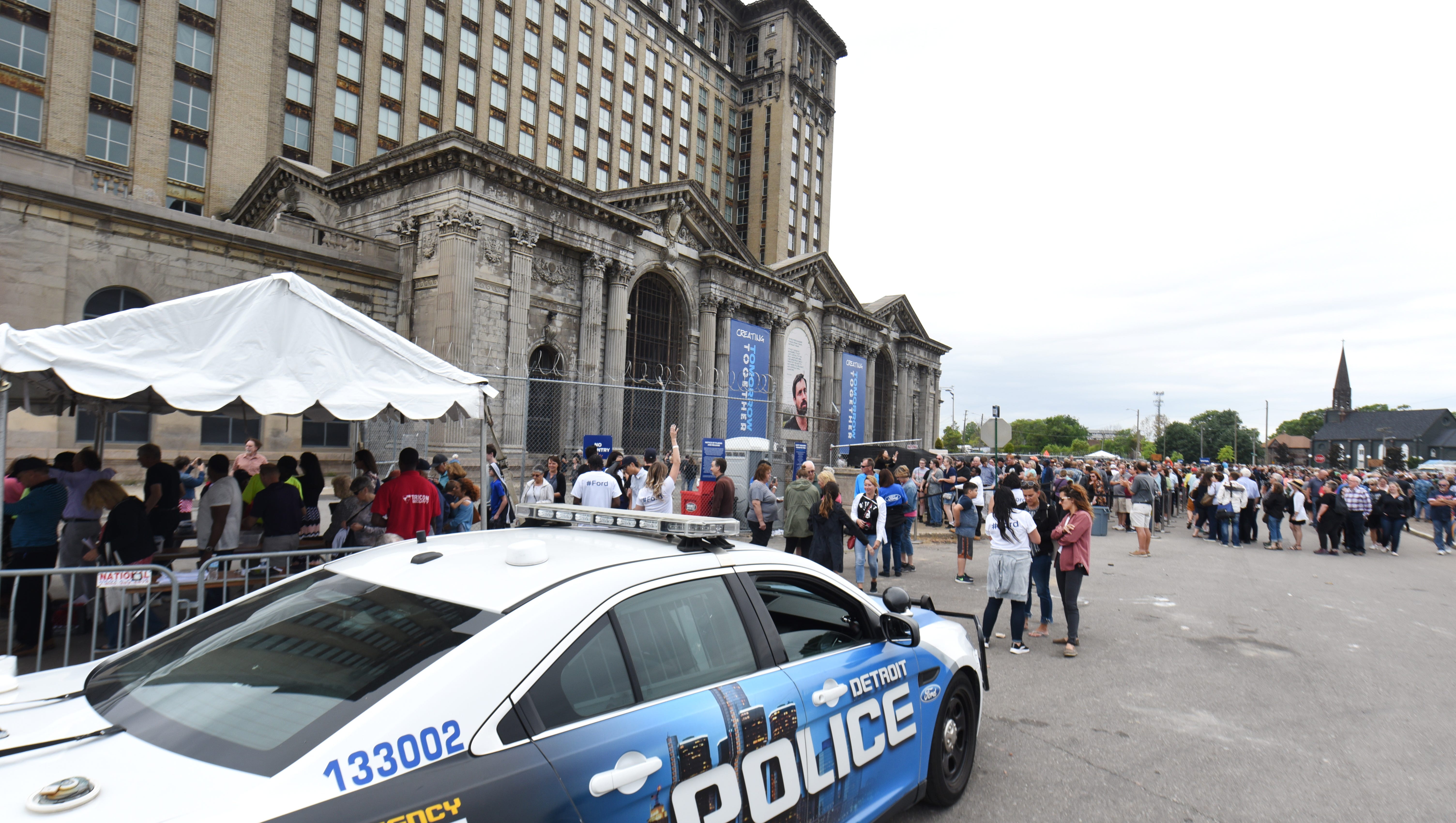 Detroit police patrol at the foot of the Michigan Central Train Depot.
