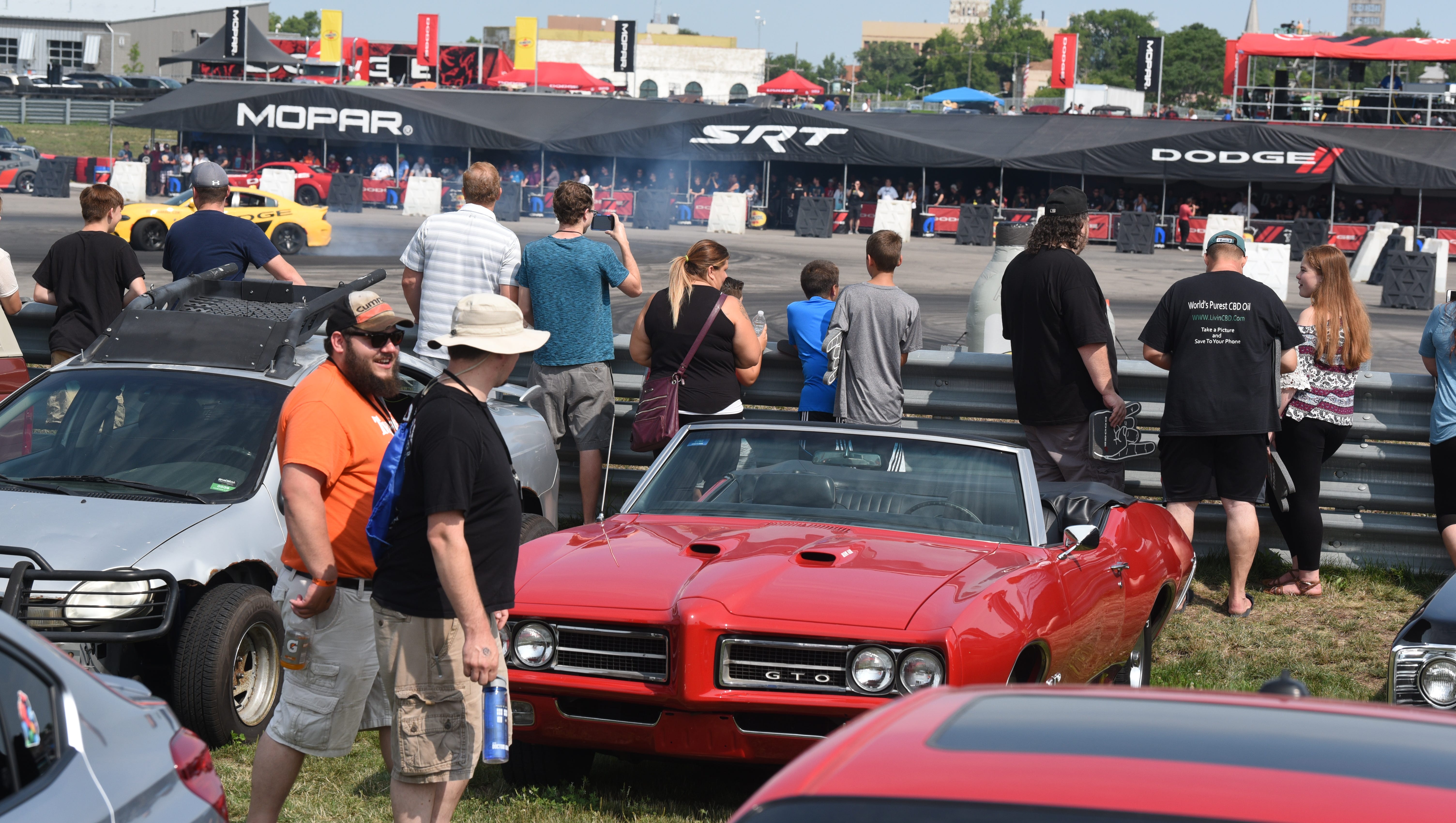 People enjoy the muscle cars on display during the Roadkill Nights event held at M1 Concourse.