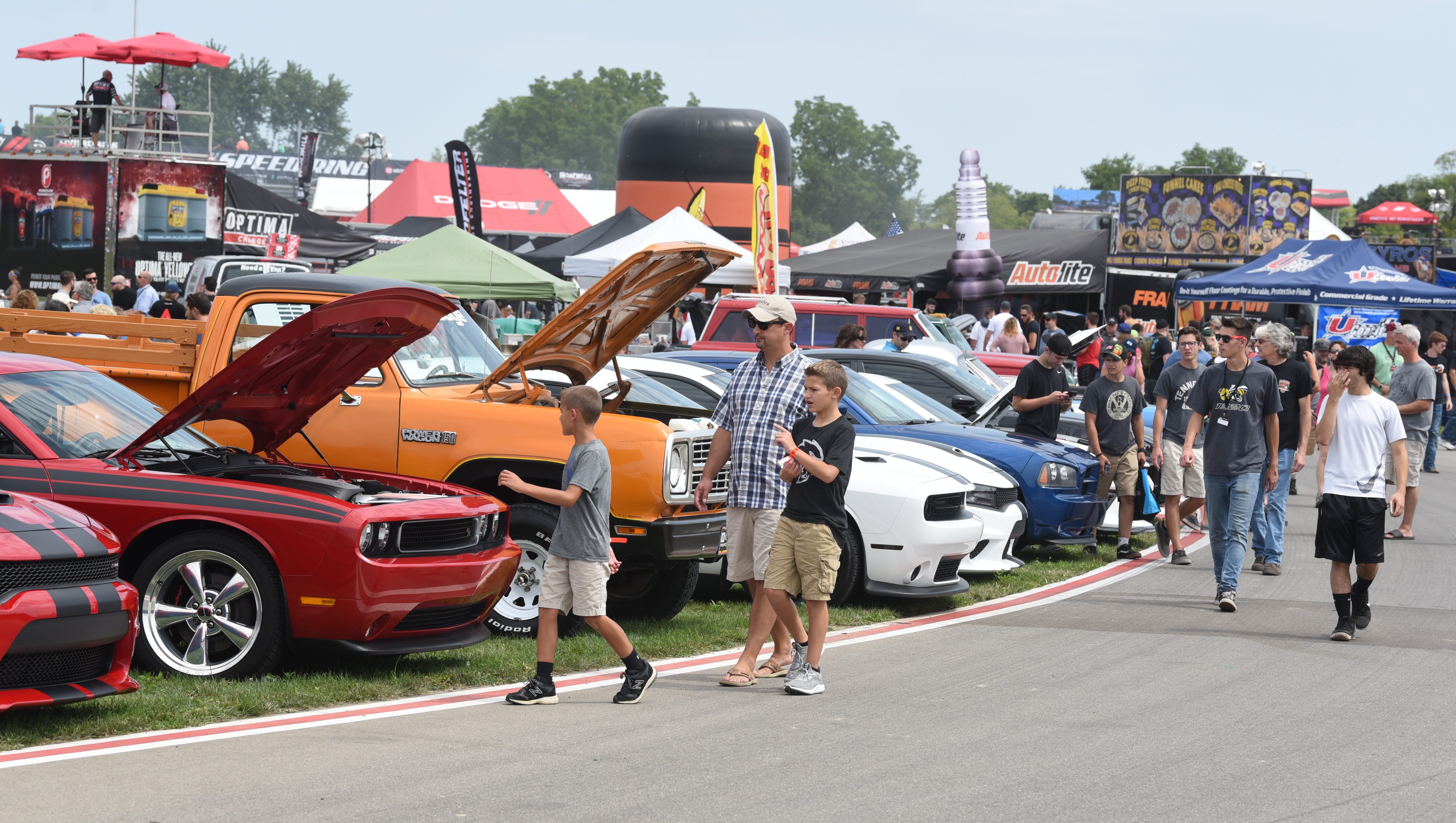 People enjoy the muscle cars on display during the Roadkill Nights.