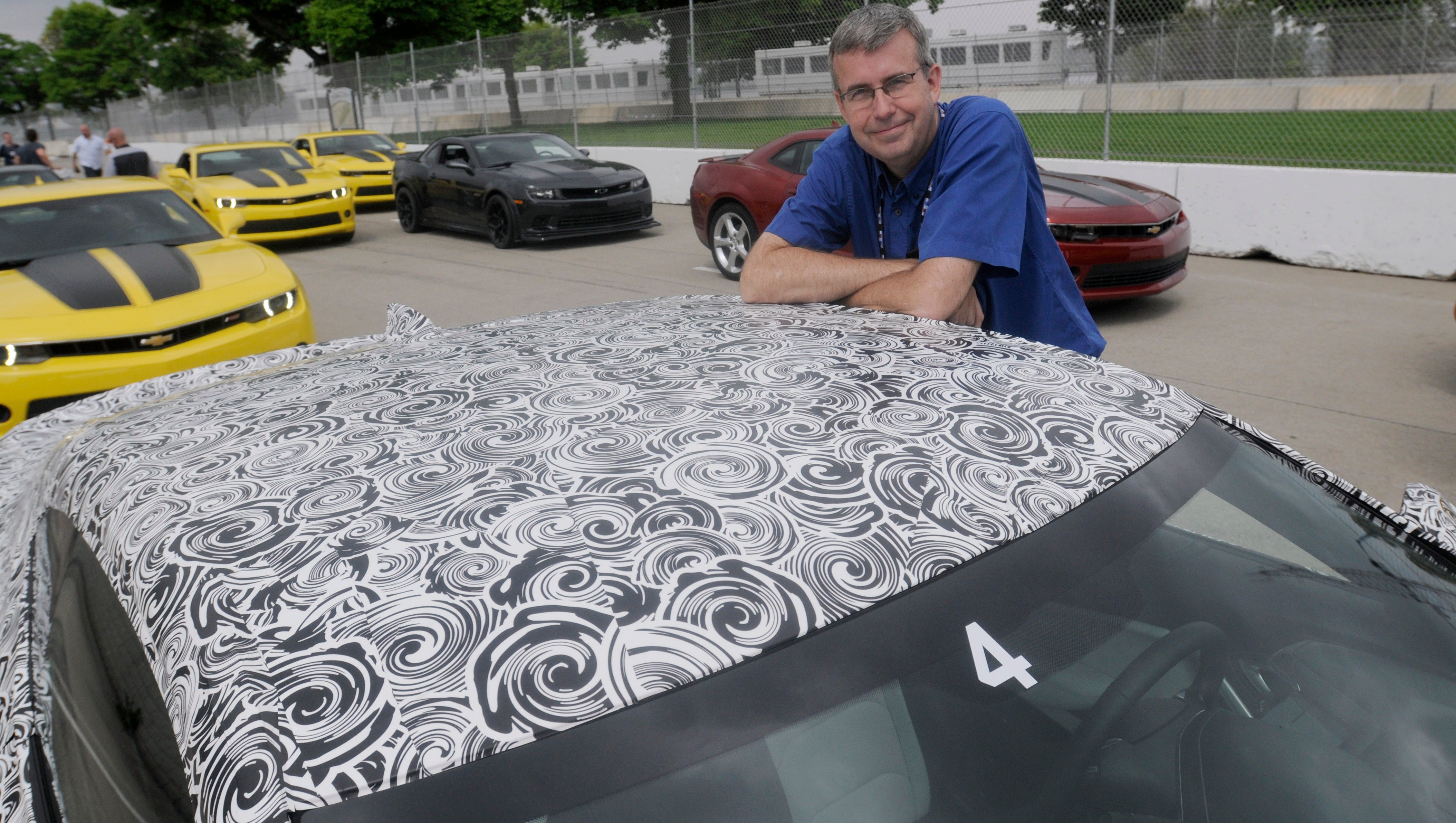 Detroit News auto critic Henry Payne is seen with the 2016 Camaro mule car.