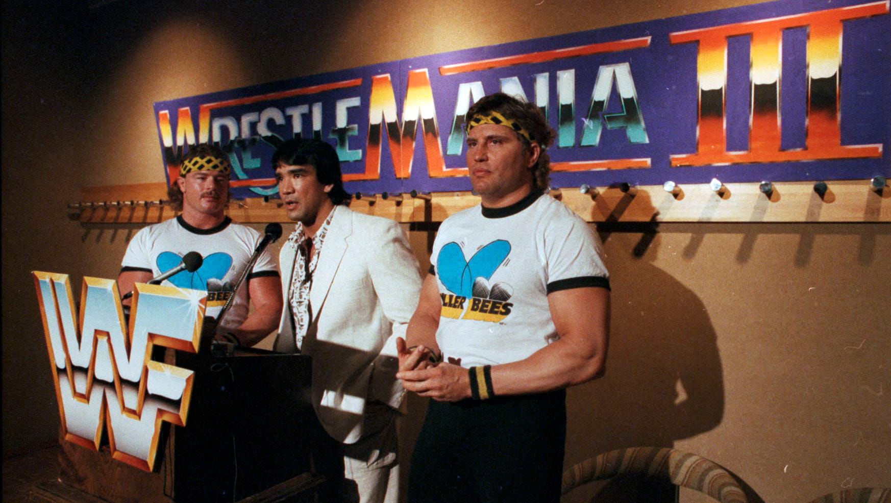 Ricky "The Dragon" Steamboat, flanked by the Killer Bees, B. Brian Blair, left, and Jim Brunzell, right, speaks at a press conference ahead of WrestleMania III.