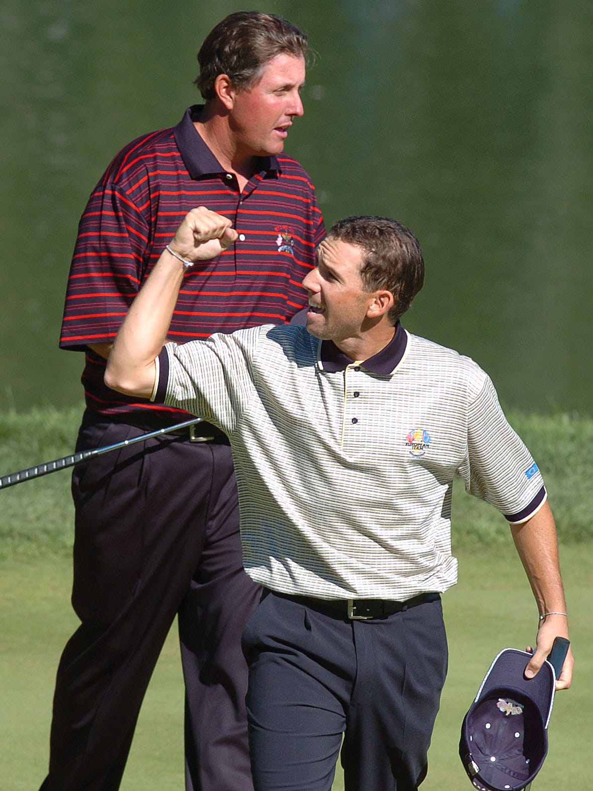 A tale of two golfers: Sergio Garcia celebrates in front of Phil Mickelson after taking his match at the 2004 Ryder Cup.