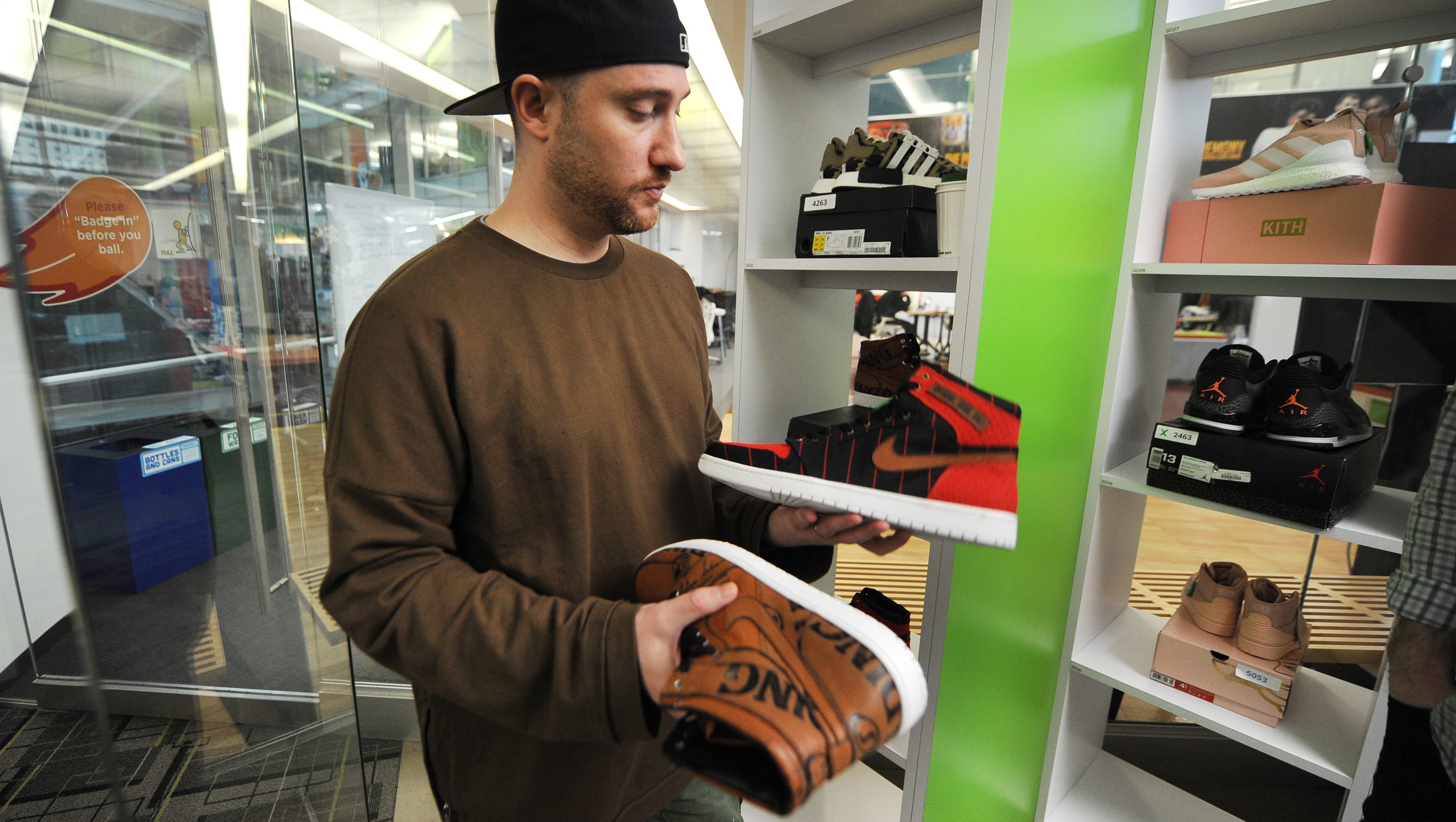 Josh Luber, CEO and Founder, Stock X,  shows a few of the special sneakers at company headquarters inside the the One Campus Martius Building in downtown Detroit.